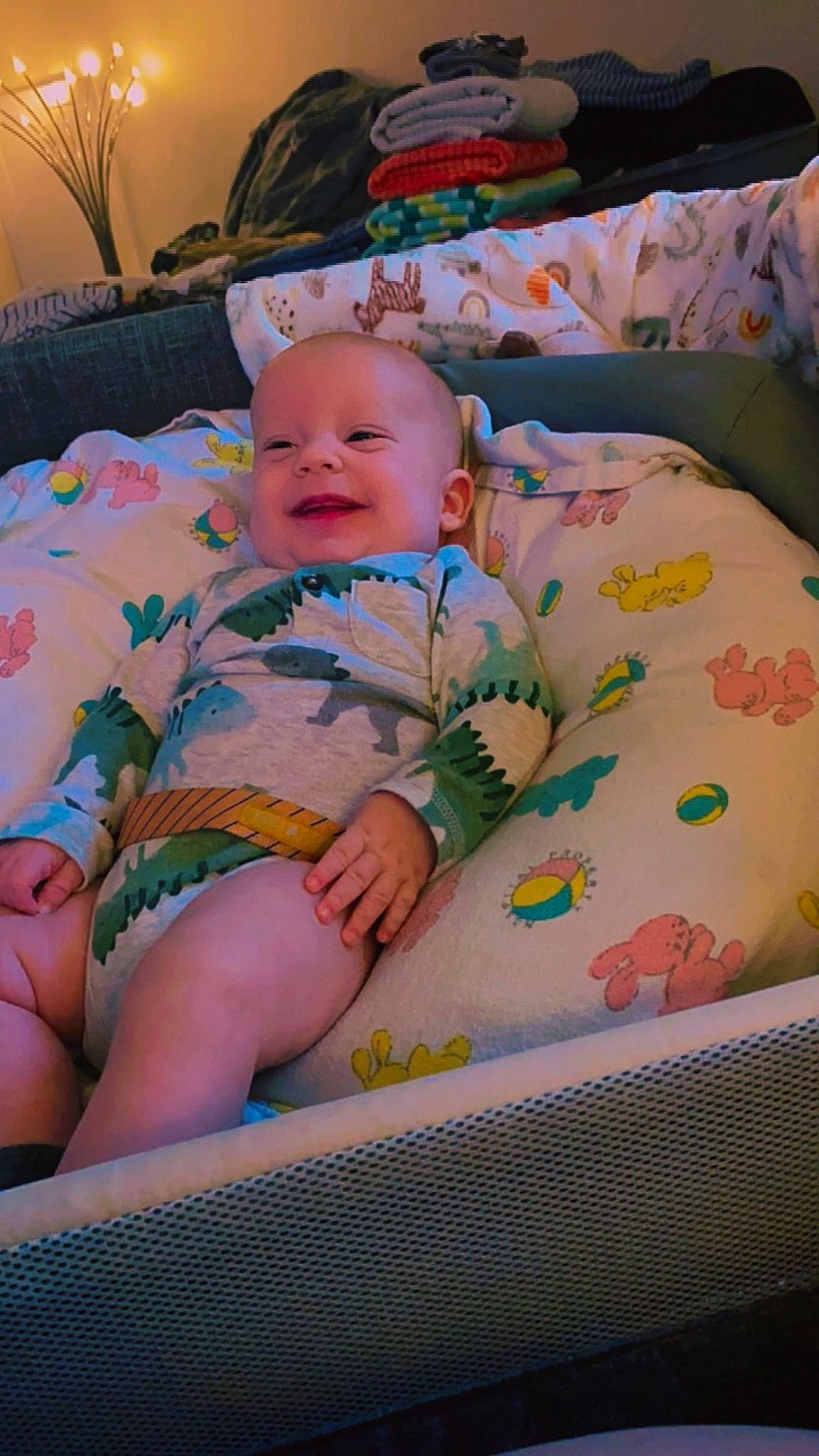 Jax joined the competition — help win amazing prizes! baby, baby_laughing, baby_products, baby_toddler_clothing, bedding, bedtime, cheek, child, comfort, couch, fun, happy, houseplant, linens, pattern, person, room, sitting, smile, thigh