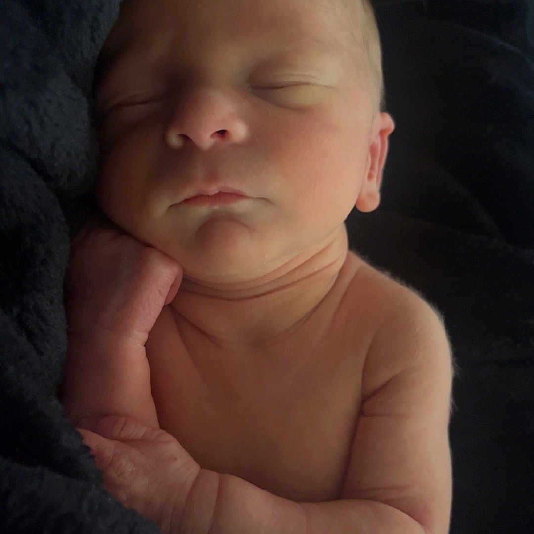 Briar joined the competition — help win amazing prizes! baby, blanket, bodypart, face, finger, hand, head, newborn, person, photography, portrait, sleeping, towel