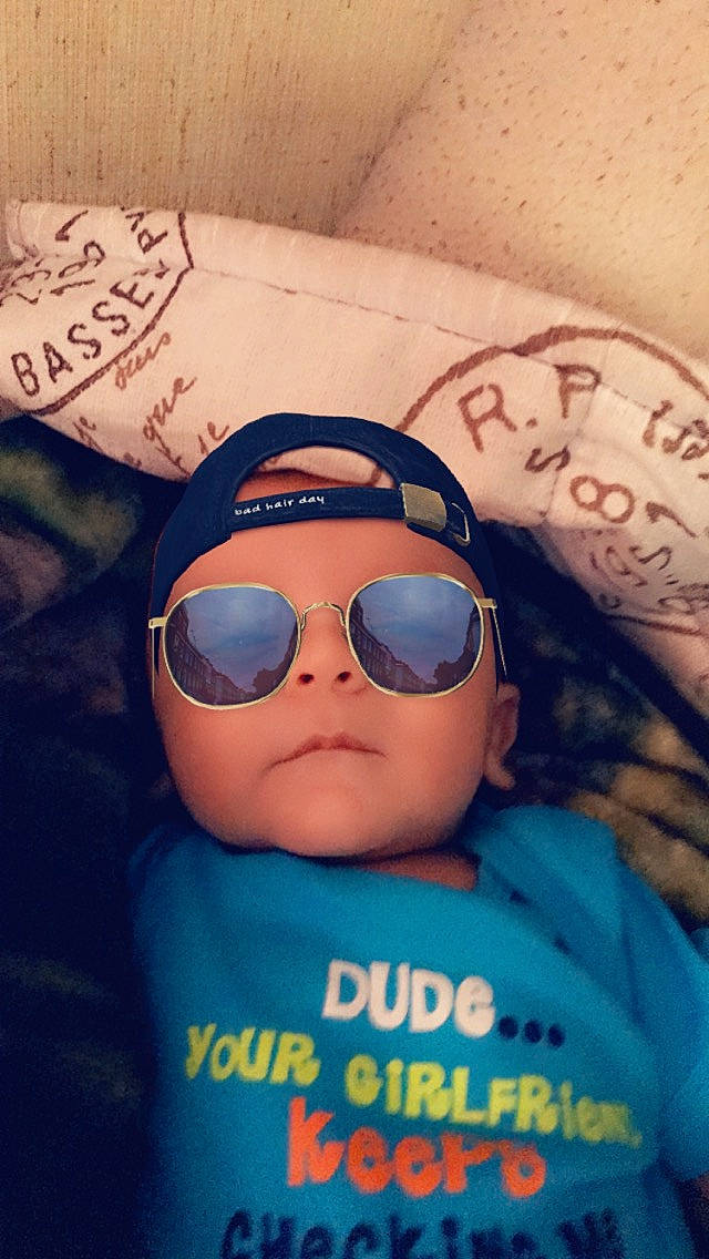 Kooper is registered to the contest to win money with this photo: baby_toddler_clothing, cap, cool, eye, eyewear, font, fun, glasses, goggles, hair, happy, headwear, mouth, person, personal_protective_equipment, selfie, skin, sleeve, sunglasses, t_shirt