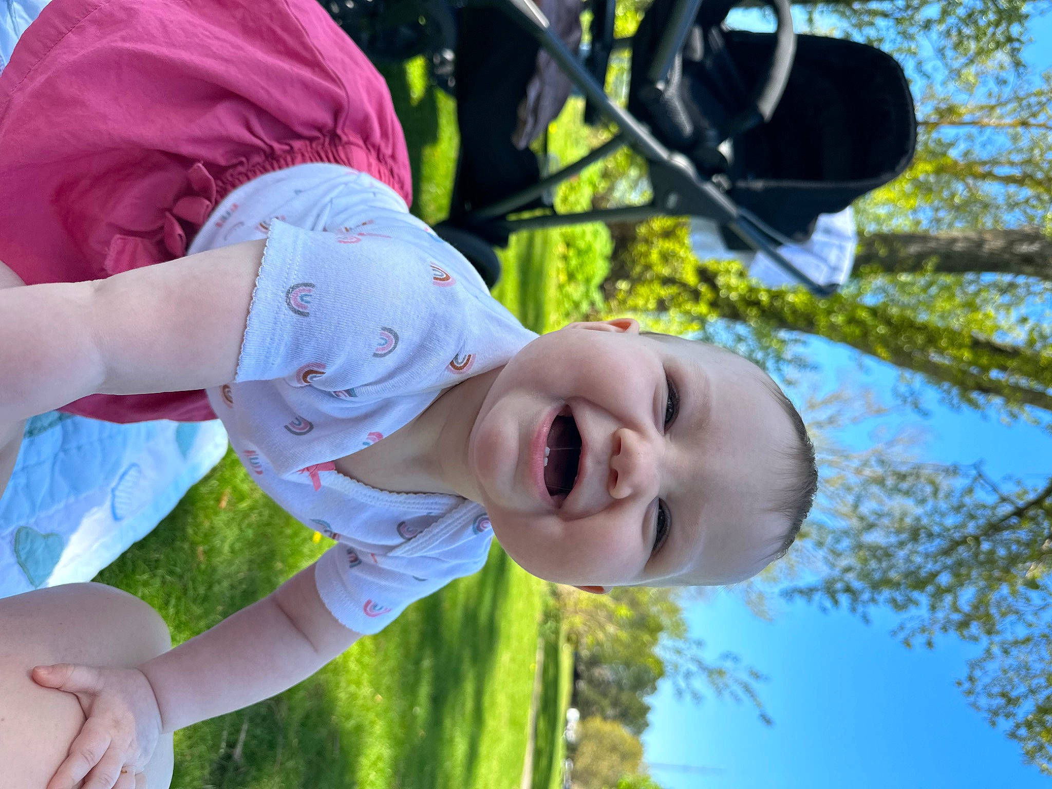 Emberly is registered to the contest to win money with this photo: baby, child, daytime, fun, gesture, grass, happy, joy, leaf, leisure, people_in_nature, person, plant, recreation, sky, smile, spring, toddler, tree, vacation