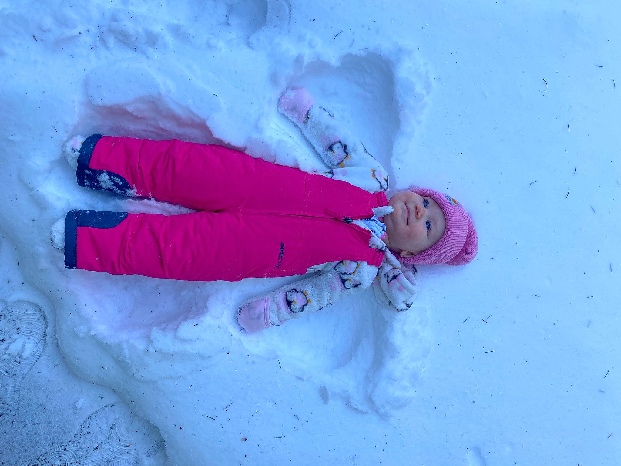 Emberly joined the competition — help win amazing prizes! carmine, child, electric_blue, freezing, fun, geological_phenomenon, glacial_landform, glove, headwear, ice_cap, magenta, person, pink, recreation, slope, smile, snow, toddler, tree, winter