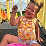 amusementpark, bodypart, child, clothing, face, female, finger, girl, hand, head, outdoorplayarea, outdoors, person, photography, playarea, portrait, shorts, slide, summer, toy