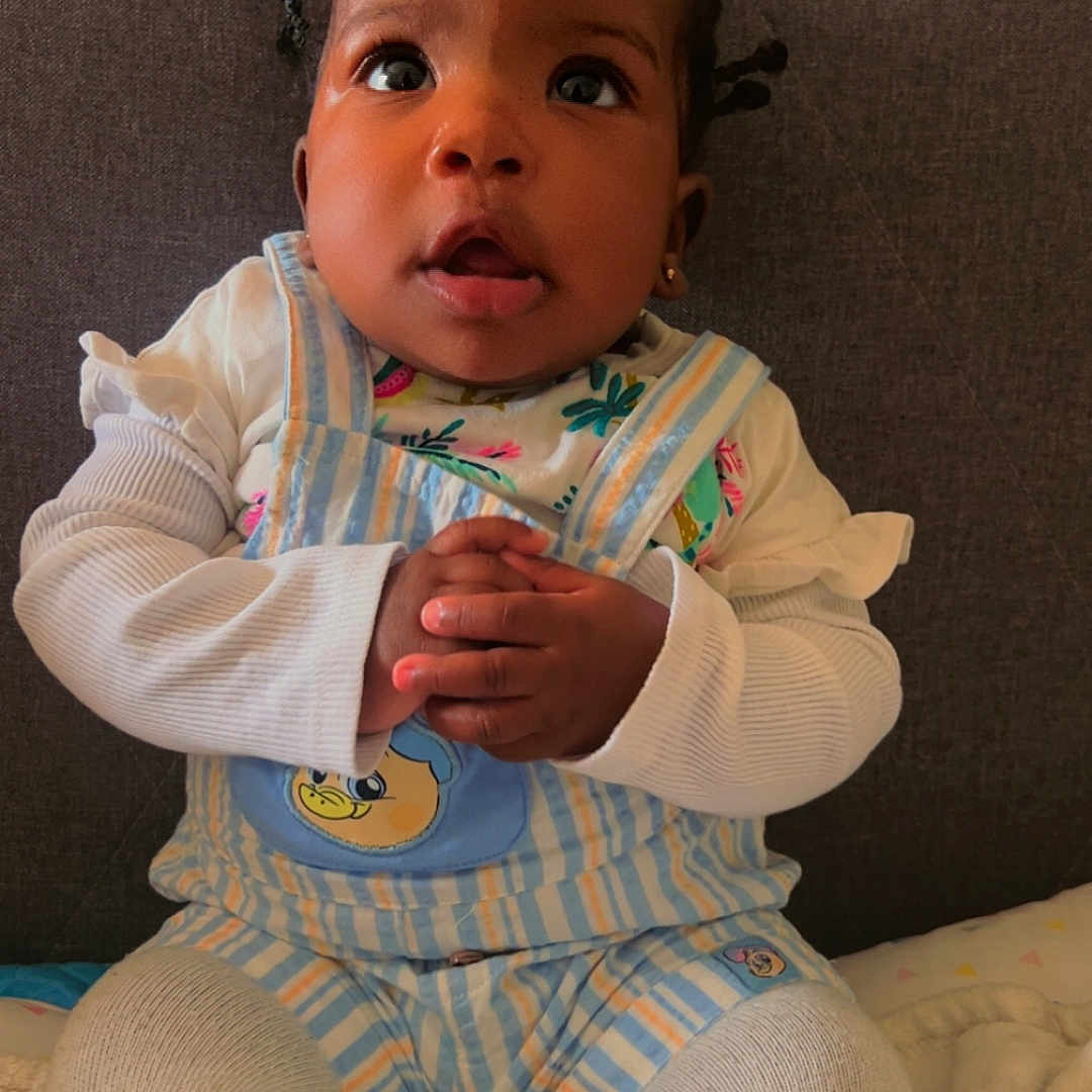 Axelle joined the competition — help win amazing prizes! baby, bodypart, bonnet, clothing, couch, cushion, face, finger, furniture, hand, hat, head, homedecor, linen, newborn, pants, person, photography, portrait, sitting