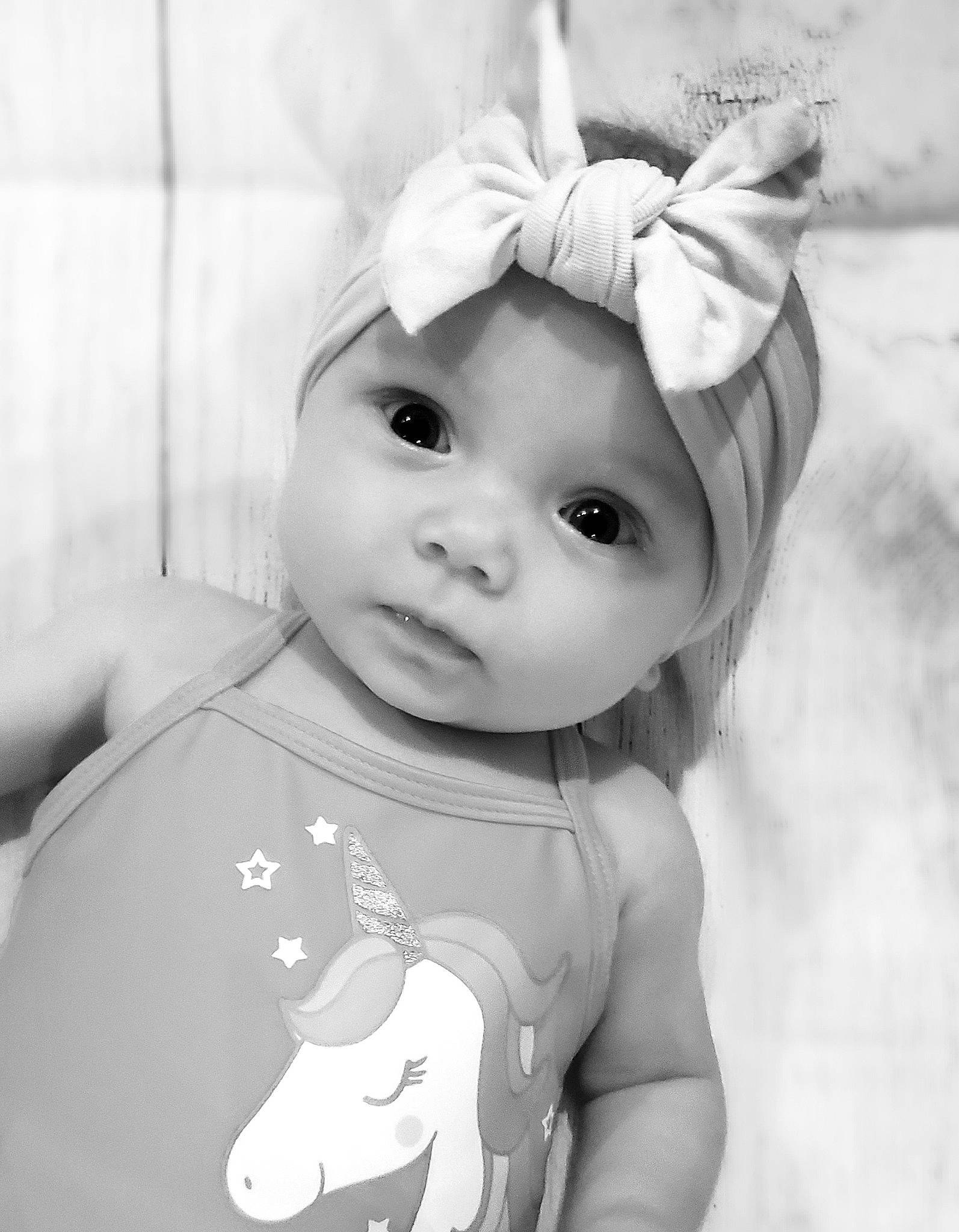 Lilith is registered to the contest to win money with this photo: baby, black_and_white, cheek, child, ear, eye, fictional_character, head, headgear, headwear, monochrome, monochrome_photography, organ, person, photography, skin, style, toddler, white