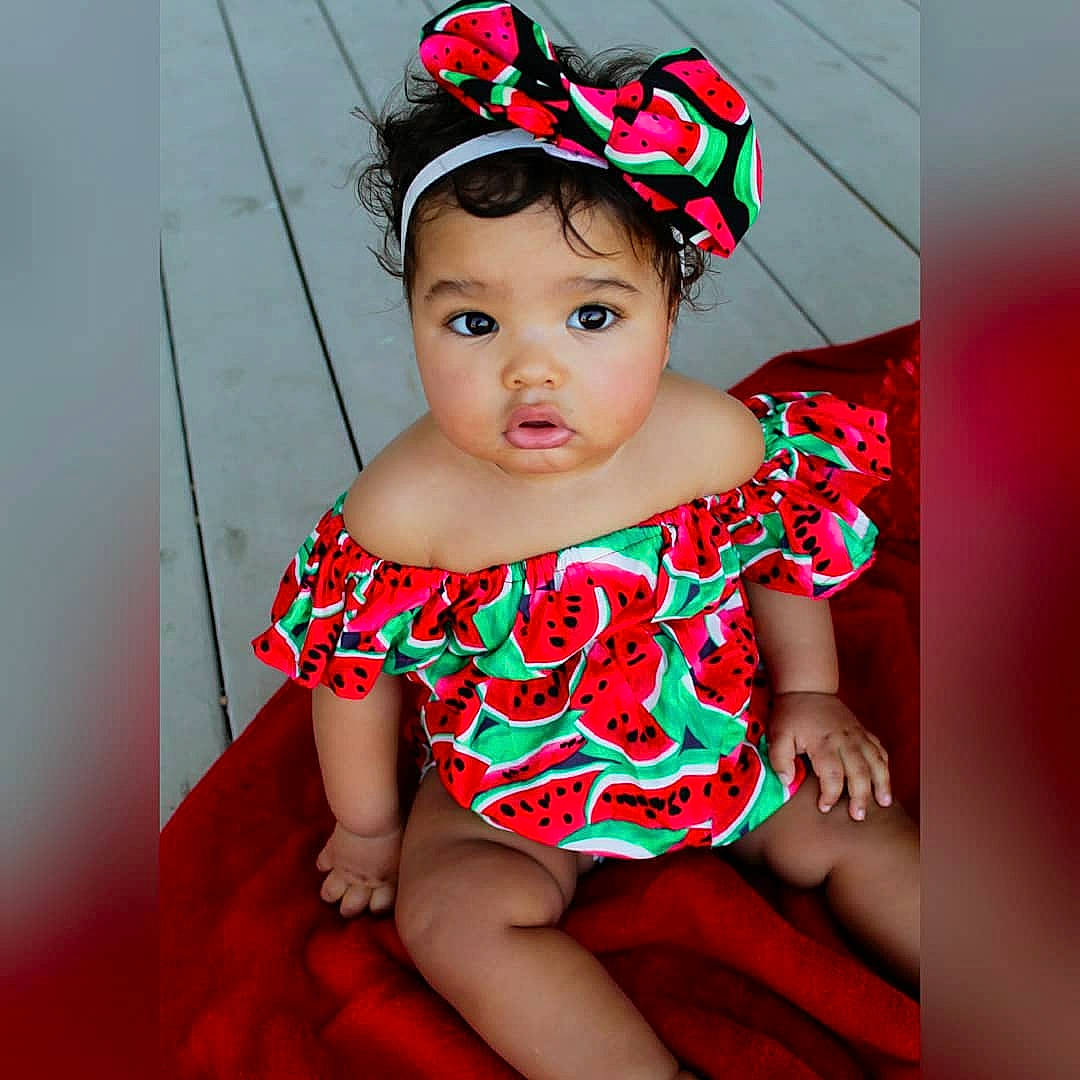 Avah is registered to the contest to win money with this photo: baby, baby_bloomers, baby_toddler_clothing, child, child_model, clothing, costume, costume_accessory, design, dress, fashion_accessory, hair_accessory, headband, headgear, pattern, person, pink, product, ruffle, toddler