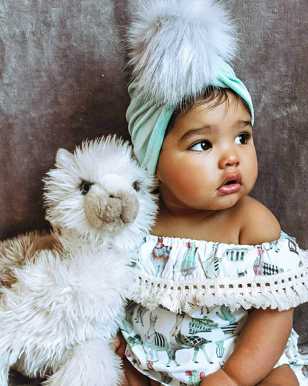 Avah is registered to the contest to win money with this photo: baby, baby_products, beanie, bonnet, child, child_model, costume_accessory, ear, fur, headgear, knit_cap, person, skin, smile, stuffed_toy, teddy_bear, toddler