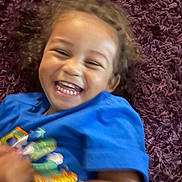 Marquis joined the competition — help win amazing prizes! blue_shirt, carpet, casual_clothing, child, curly_hair, cute, face, happy, head, indoor, joyful, laughing, motion_blur, person, playful, portrait, purple_carpet, small_child, smiling, toddler