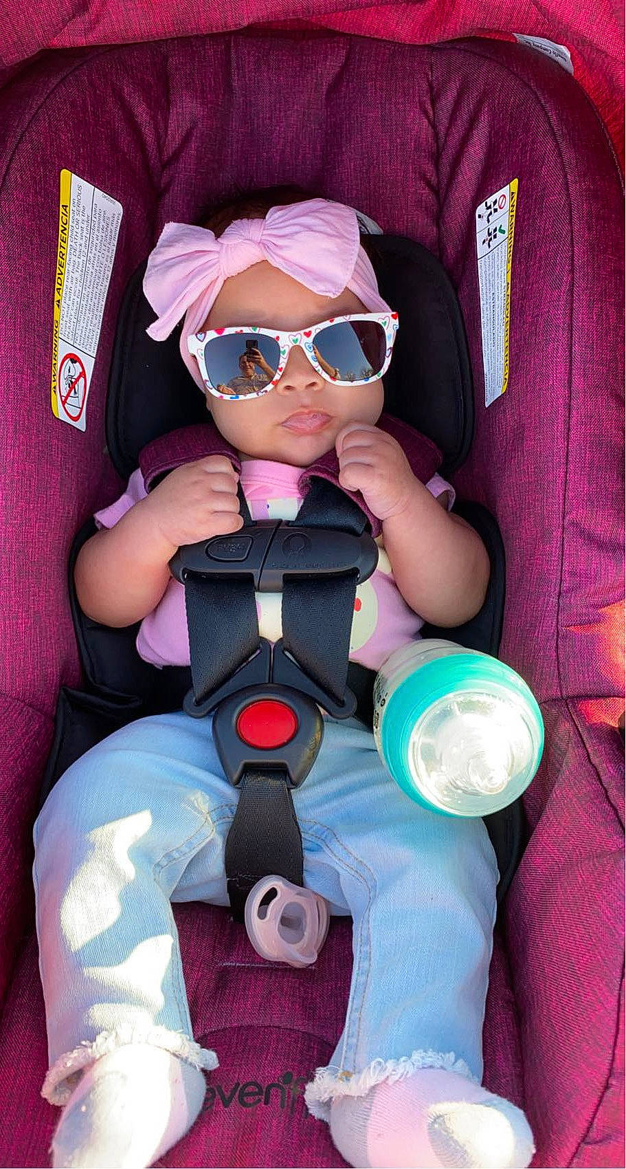 Zyanna joined the competition — help win amazing prizes! arm, auto_part, baby_toddler_clothing, car_seat, comfort, eyewear, fictional_character, finger, gesture, goggles, headwear, magenta, person, personal_protective_equipment, pink, purple, sleeve, sunglasses, thigh, thumb