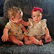 Peyton And Parker is registered to the contest to win money with this photo: baby, babies, child, infant, toddler, cute, clothing, headband, pink_bow, striped_dress, yellow_outfit, sitting, chair, furniture, indoor, hand_touch, barefoot, portrait, face, expression