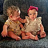 baby, babies, child, infant, toddler, cute, clothing, headband, pink_bow, striped_dress, yellow_outfit, sitting, chair, furniture, indoor, hand_touch, barefoot, portrait, face, expression