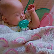 Esme joined the competition — help win amazing prizes! baby, sleeping, pacifier, blanket, rainbow_pattern, infant, child, resting, soft, pastel_colors, cozy, cute, comfort, bedtime, face, head, hand, clothing, seat, nursery