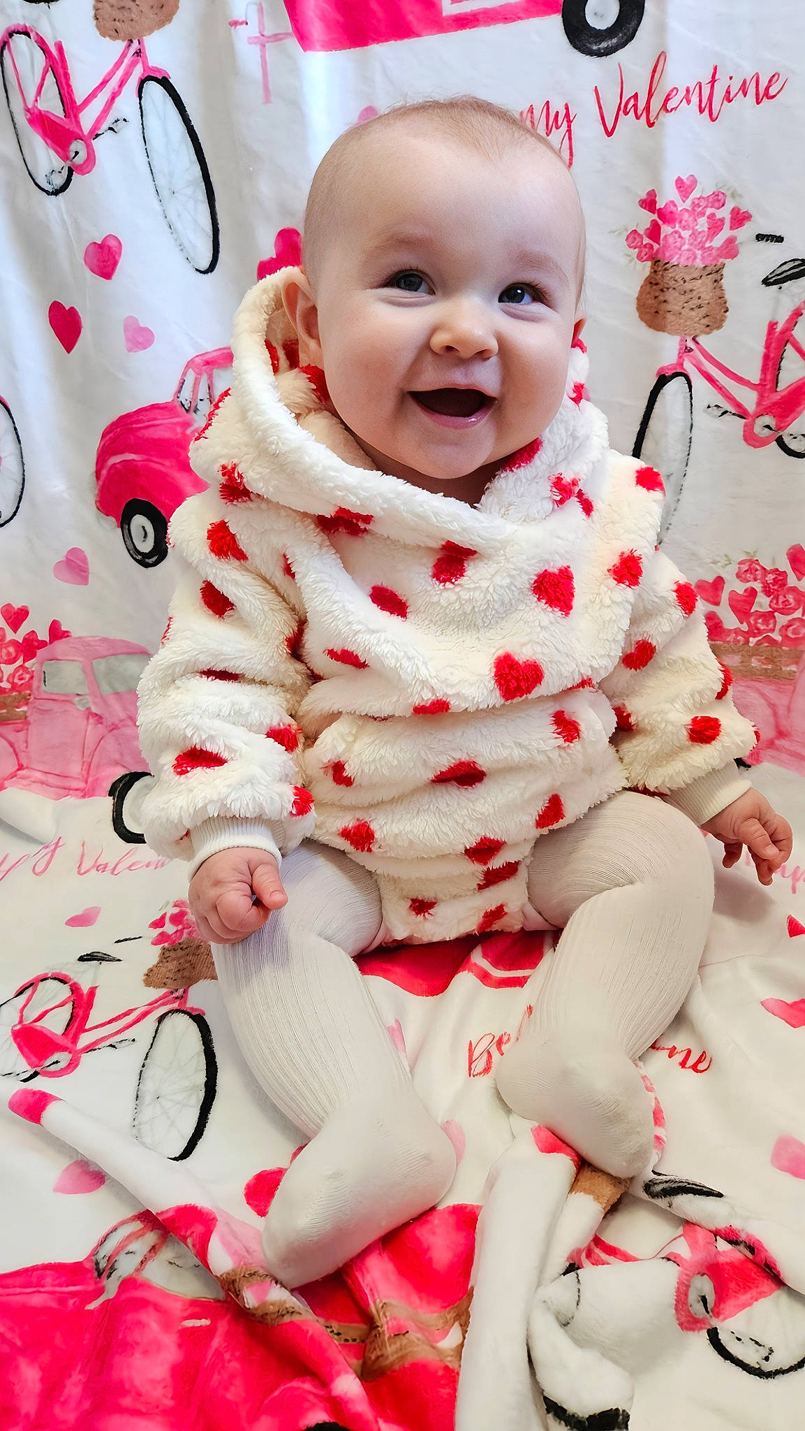 Charlie joined the competition — help win amazing prizes! baby, baby_toddler_clothing, cheek, child, event, face, happy, head, human_leg, joy, knee, pattern, person, pink, red, skin, sleeve, smile, textile, thigh