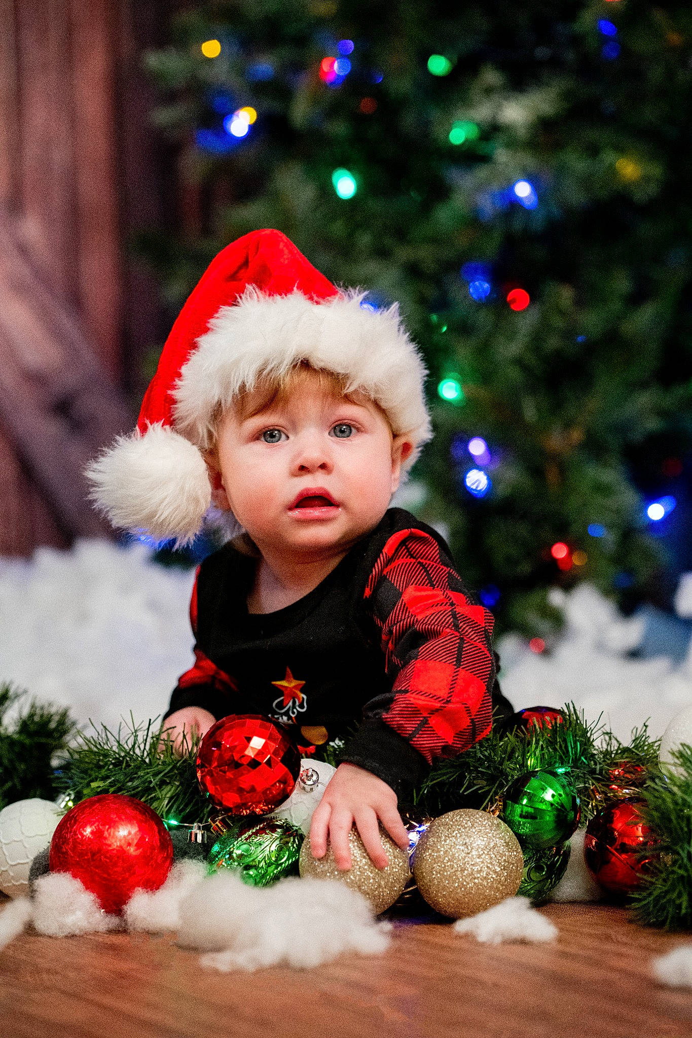 Finnan joined the competition — help win amazing prizes! christmas, christmas_decoration, christmas_ornament, christmas_tree, facial_expression, grass, green, happy, head, headwear, holiday, human_body, leaf, mammal, people, person, plant, red, toddler, tree