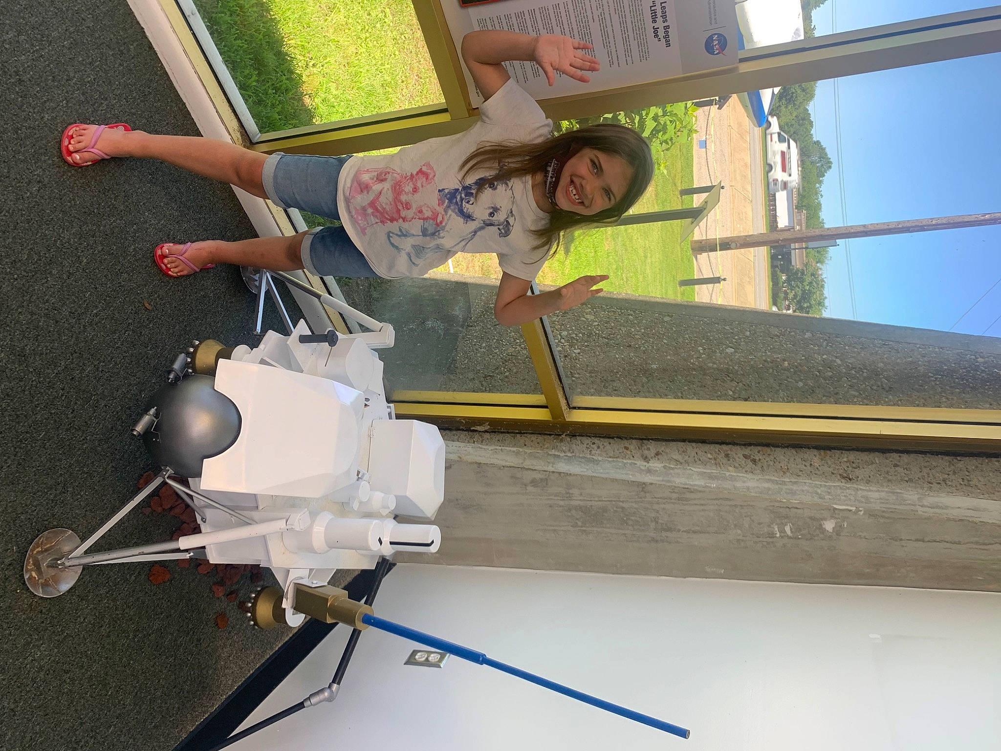 Jillian is registered to the contest to win money with this photo: building, fun, grass, green, joy, leisure, light, line, machine, person, recreation, sky, smile, toddler, window, wood