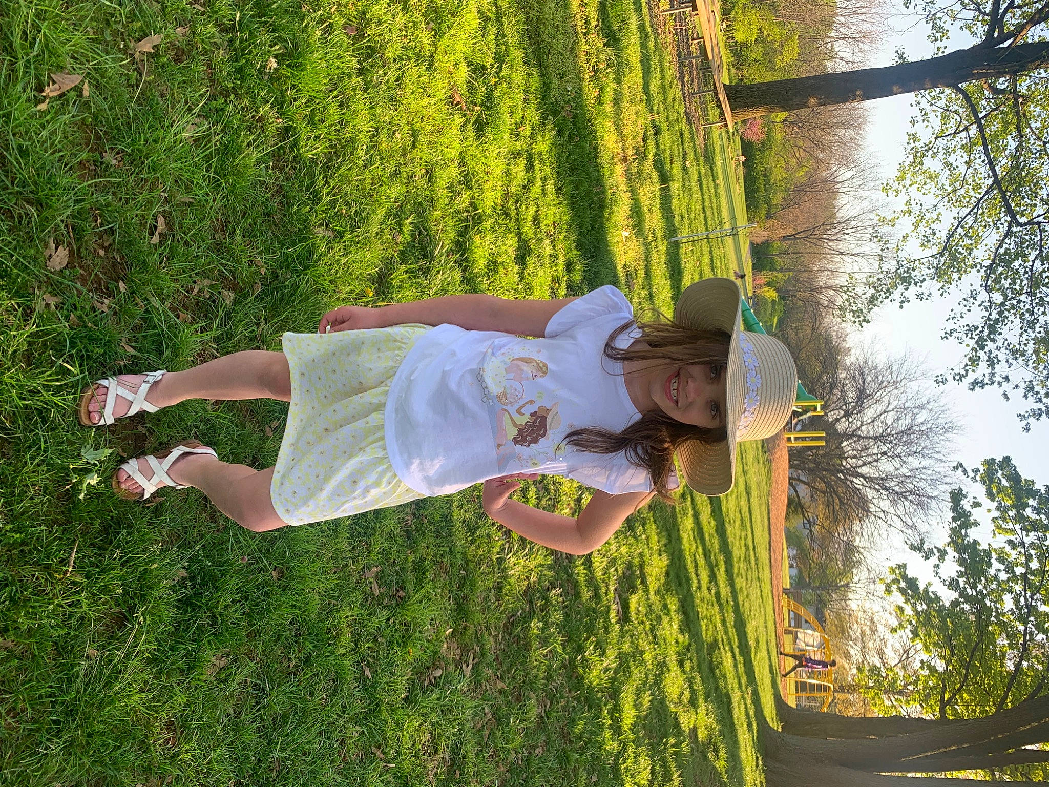 Jillian is registered to the contest to win money with this photo: fun, grass, grass_family, grassland, happy, hat, headwear, joy, landscape, leisure, people_in_nature, person, plant, recreation, shrub, sky, sunlight, t_shirt, thigh, tree