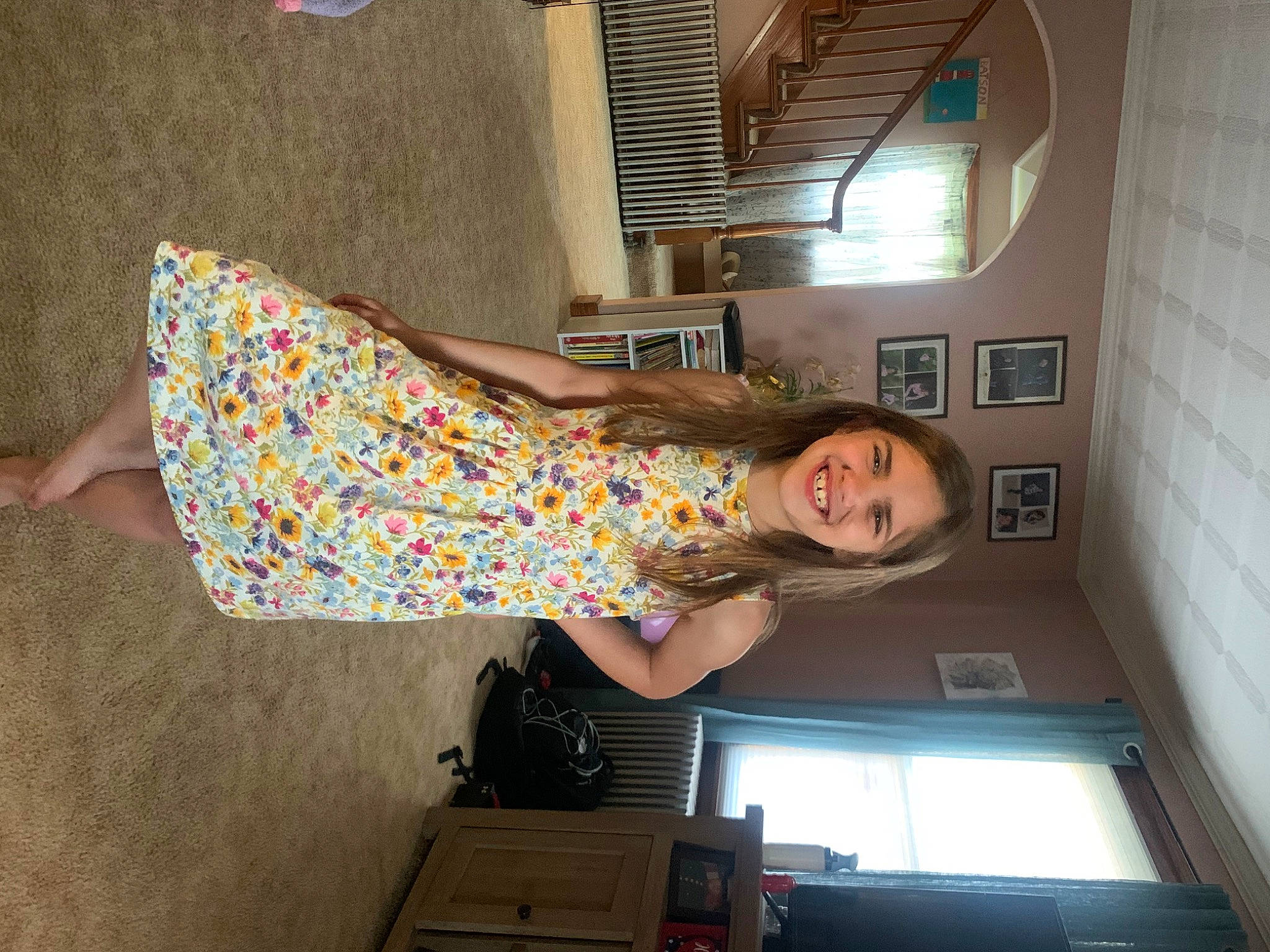 Jillian is registered to the contest to win money with this photo: box, ceiling, cocktail_dress, comfort, dress, floor, flooring, fun, house, human_leg, joy, leg, magenta, pattern, person, room, shipping_box, smile, stairs, thigh