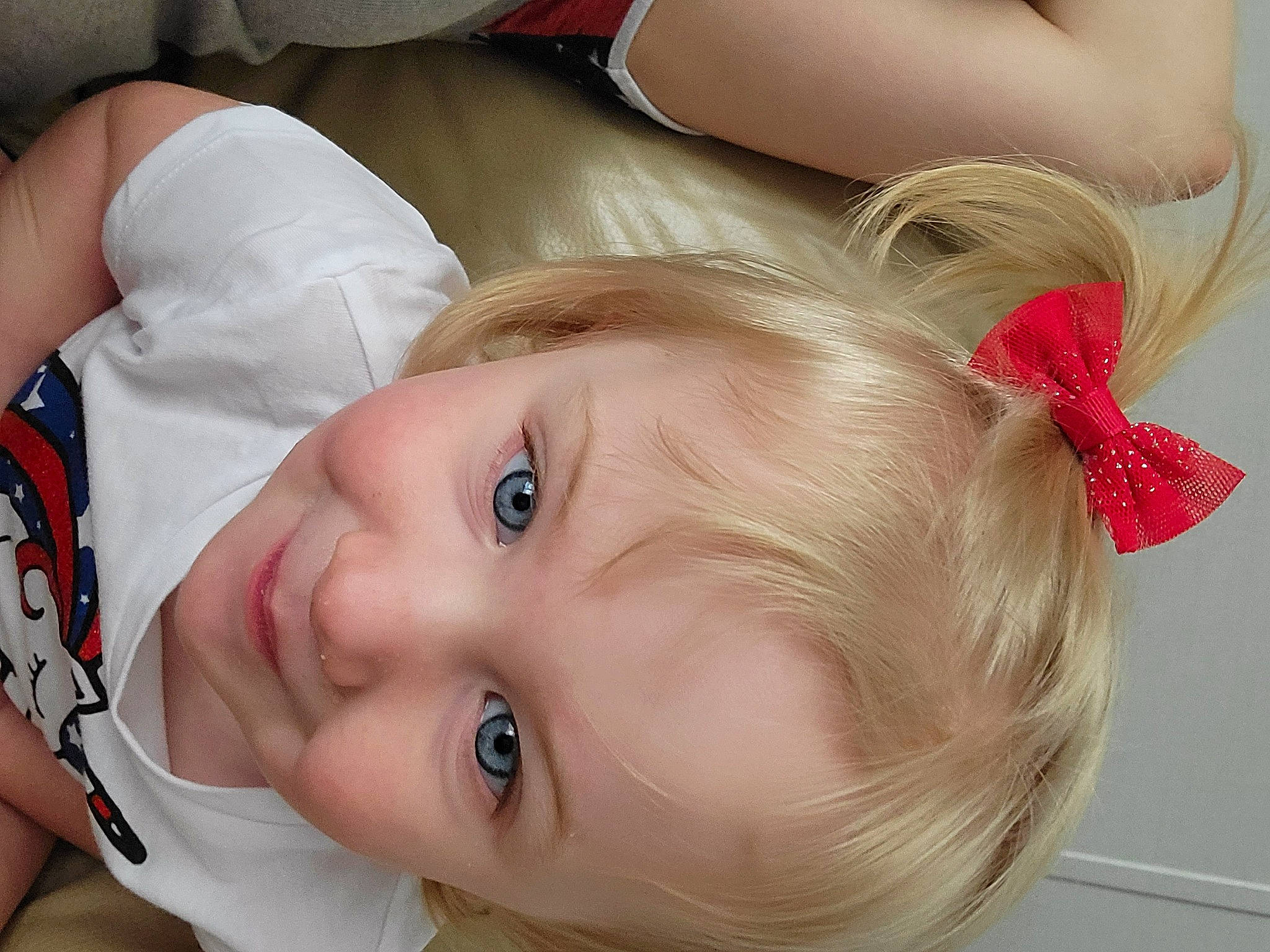 Madisyn is registered to the contest to win money with this photo: baby_toddler_clothing, blond, brown_hair, cheek, child, comfort, ear, eye, eyelash, forehead, grass, happy, lip, mouth, neck, nose, person, skin, smile, throat