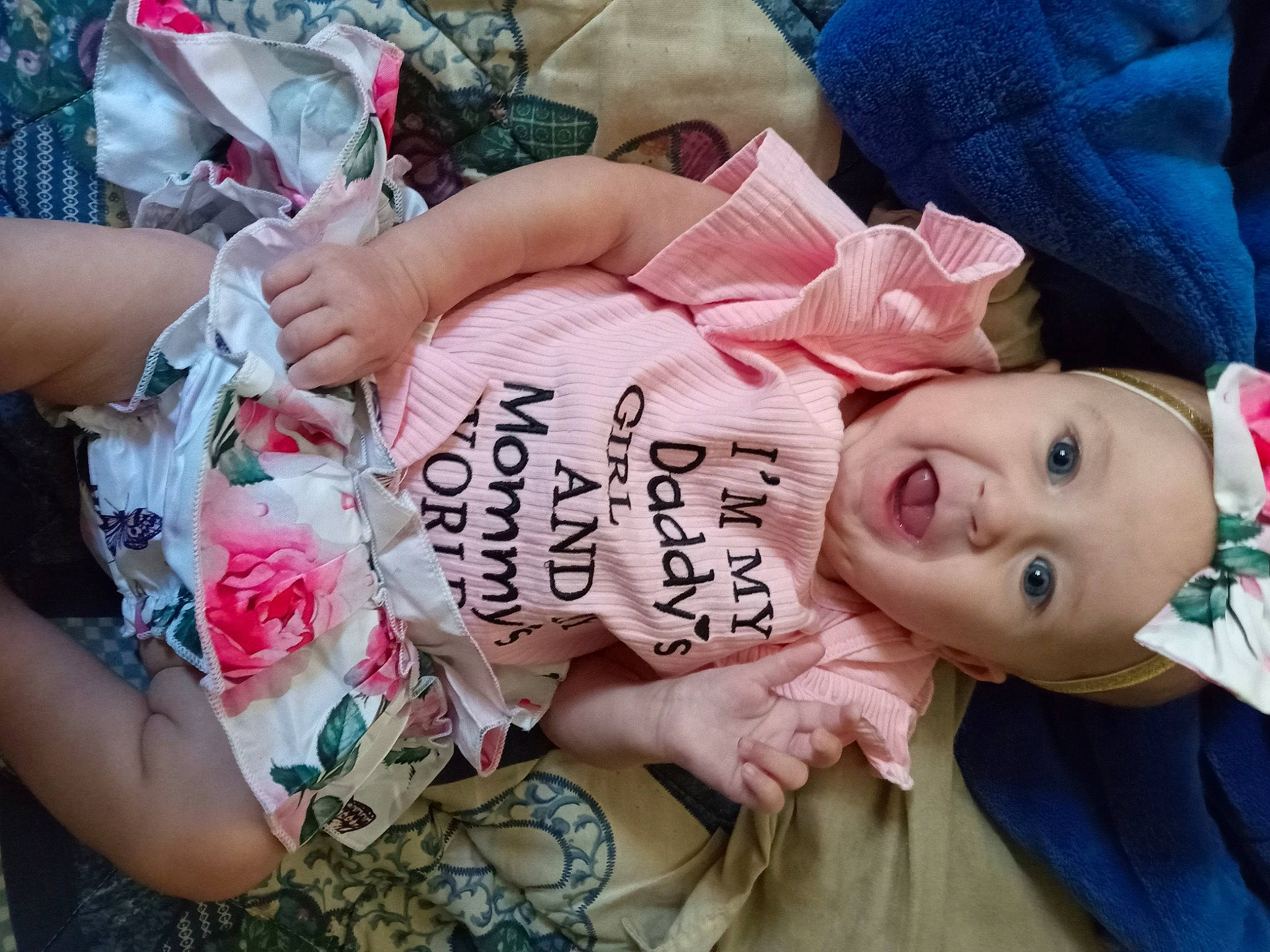 Jaylynn is registered to the contest to win money with this photo: bangs, cheek, chest, child, eyelash, finger, flesh, fur, happy, headwear, nail, pattern, peach, person, pink, plant, rose, rose_family, rose_order, skin