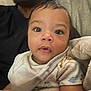 Yasahn is registered to the contest to win money with this photo: baby, child, infant, blanket, cozy, curious, face, eyes, expression, person, portrait, closeup, indoor, soft, warm, clothing, adult, family, cuddle, comfort