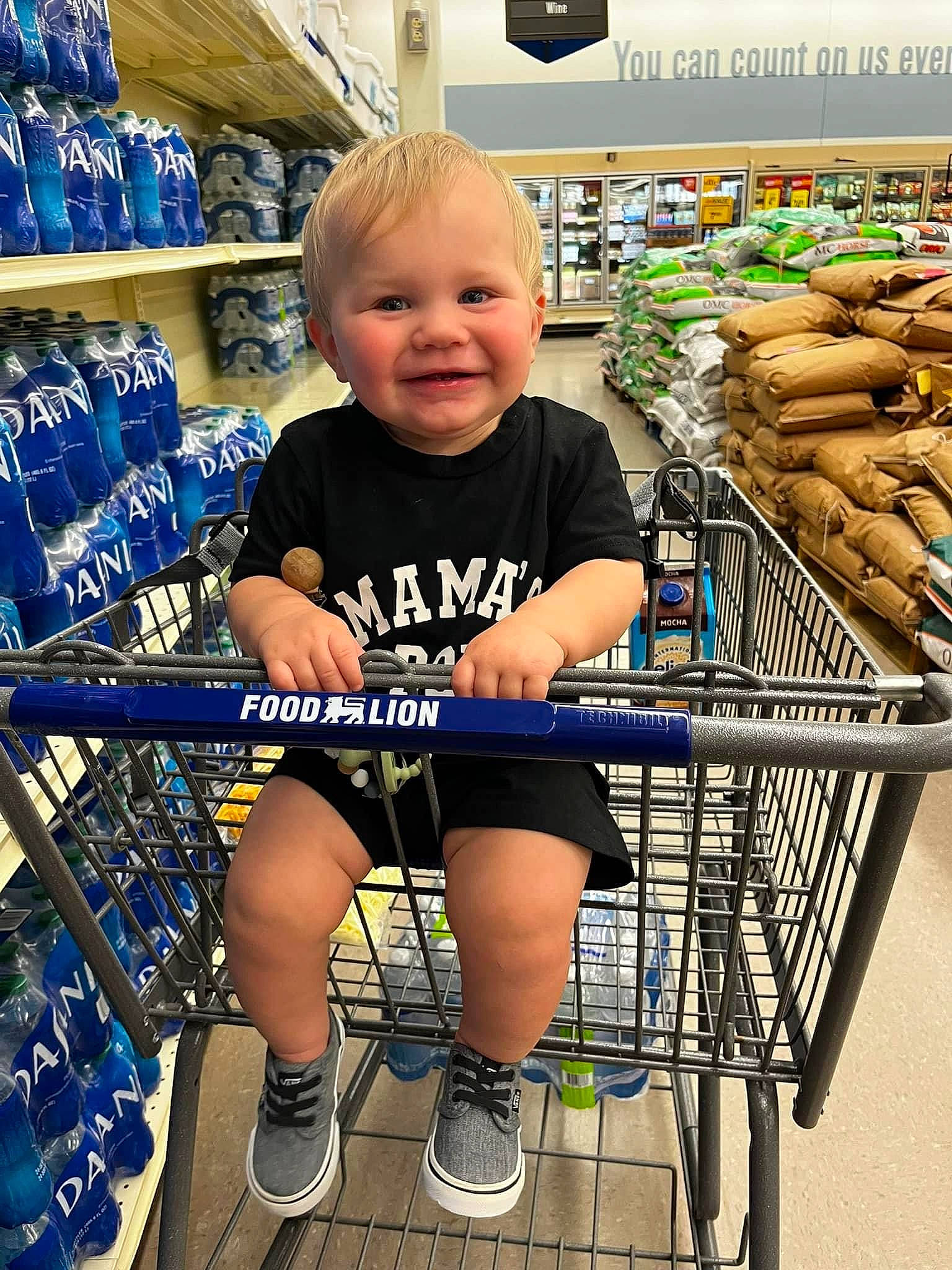 Trace is registered to the contest to win money with this photo: child, clothing, convenience_store, customer, fun, grocery_store, human_leg, joy, leg, leisure, person, product, retail, shelf, shelving, shoe, shopping, shopping_cart, smile, snapshot