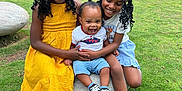 Kayden joined the competition — help win amazing prizes! braided_hair, casual_clothing, child, children, family, fence, grass, happy, laughing, nature, outdoor, park, playful, shoes, smiling, stone, sunny_day, tennis_court, toddler, yellow_dress