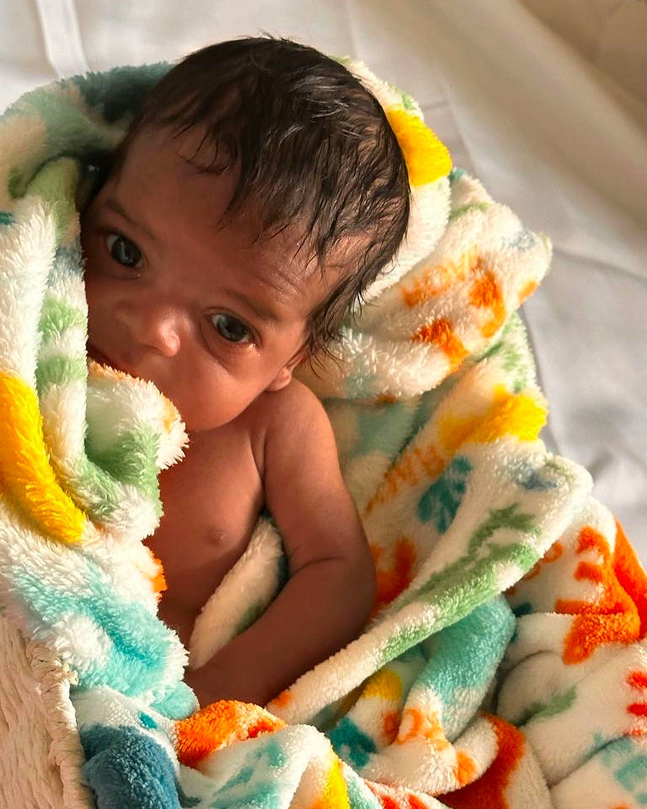 Kaleb joined the competition — help win amazing prizes! baby, baby_products, baby_toddler_clothing, cheek, child, comfort, eye, finger, happy, head, iris, linens, mammal, nail, nose, orange, person, skin, textile, thumb