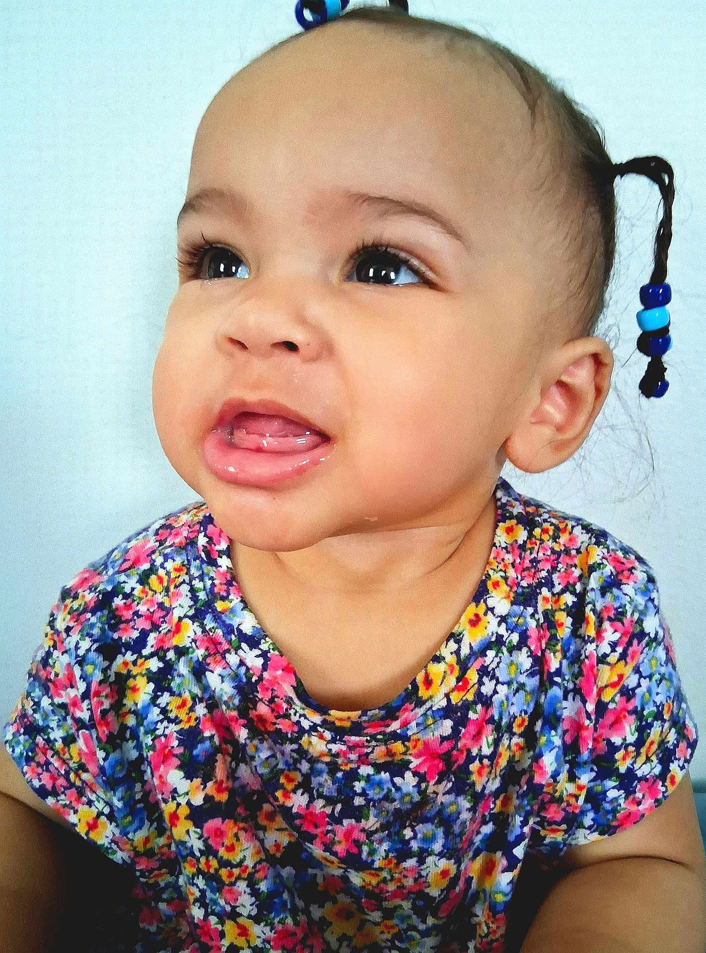 Harlow joined the competition — help win amazing prizes! toddler, child, face, portrait, expression, braid, beads, hair, colorful_clothing, floral_pattern, cute, young_child, skin, eyes, mouth, indoor, person, head, baby, curious
