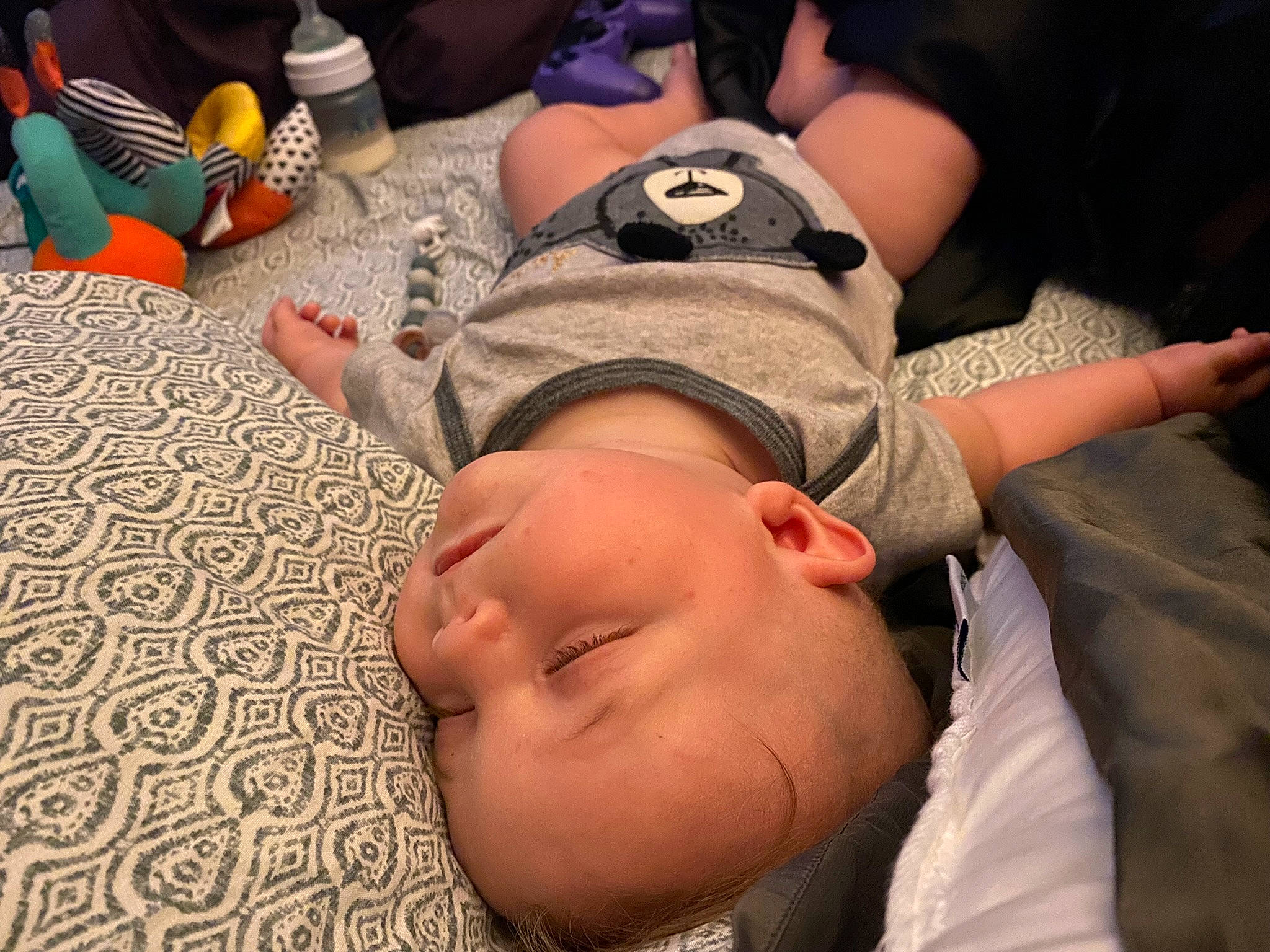 Liam is registered to the contest to win money with this photo: abdomen, baby, bedtime, chest, comfort, elbow, finger, flooring, fun, gesture, happy, human_leg, joint, mouth, neck, pattern, person, thumb, toddler, trunk