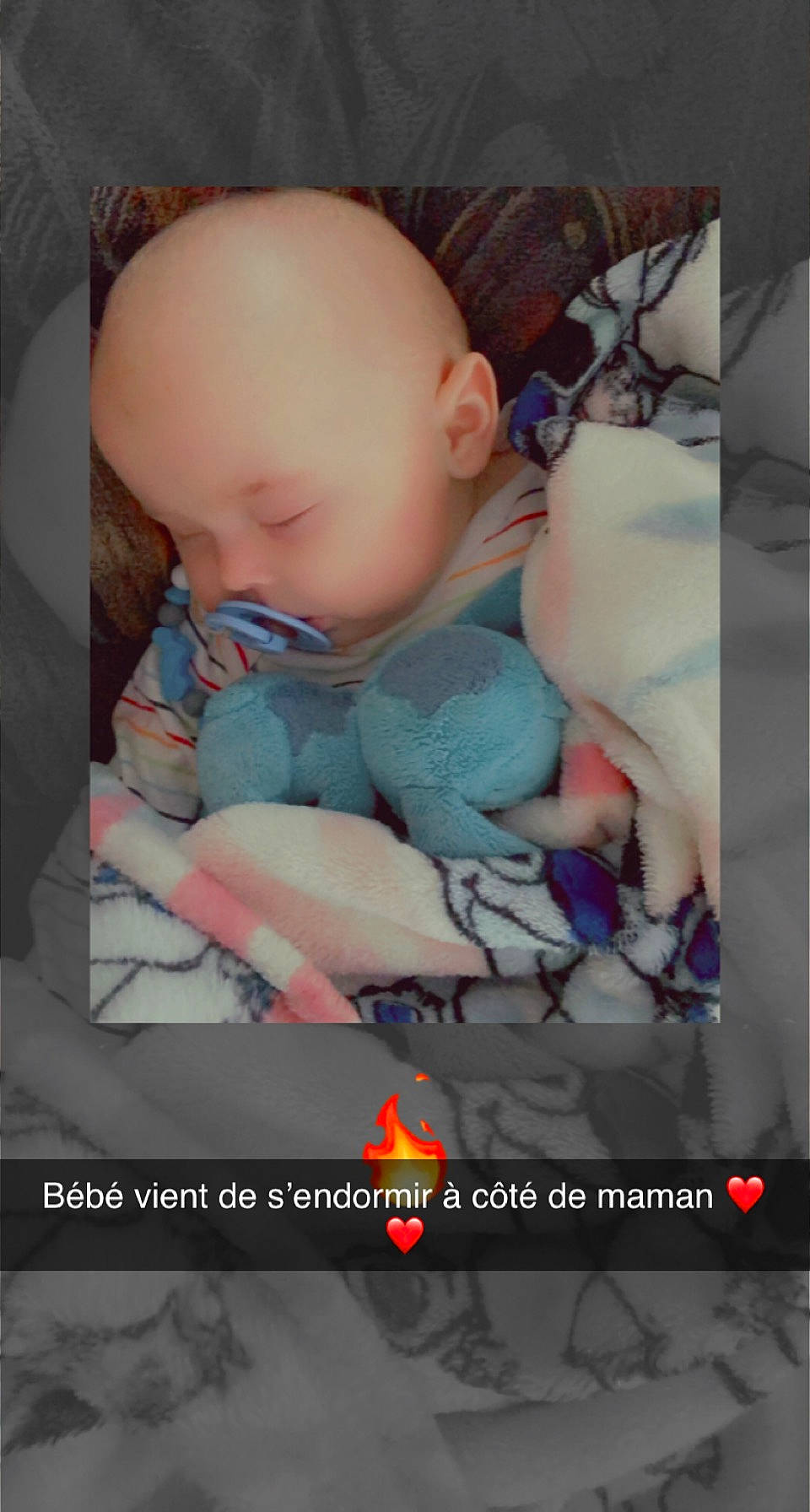 Timaël participe au concours pour gagner de l'argent avec cette photo : baby, baby_carriage, baby_products, baby_sleeping, baby_toddler_clothing, baby_toys, bedtime, car_seat, cheek, child, comfort, doll, flash_photography, linens, mouth, person, photo_caption, room, sitting, toddler