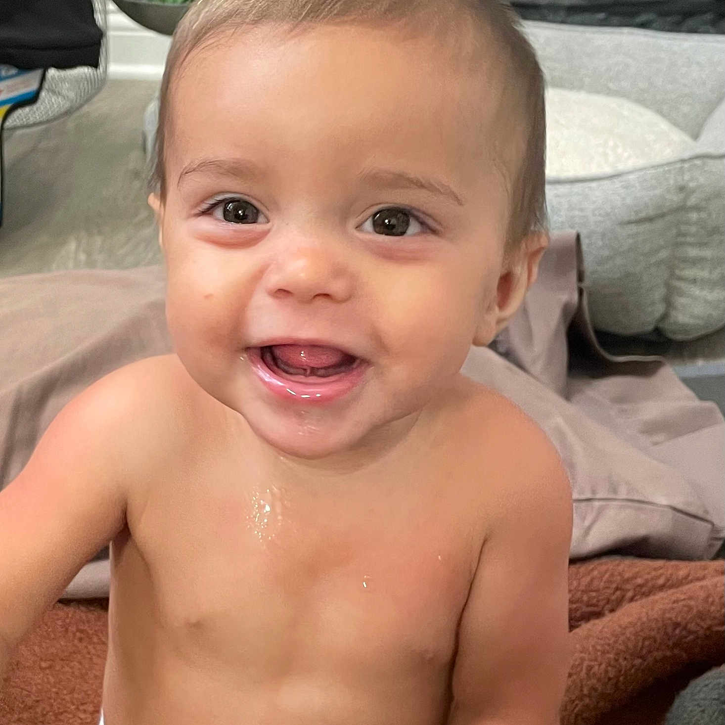 Zariyan is registered to the contest to win money with this photo: baby, blanket, child, couch, cute, diaper, expression, eyes, face, furniture, happy, indoor, mouth, portrait, sitting, skin, smiling, toddler, tongue, young