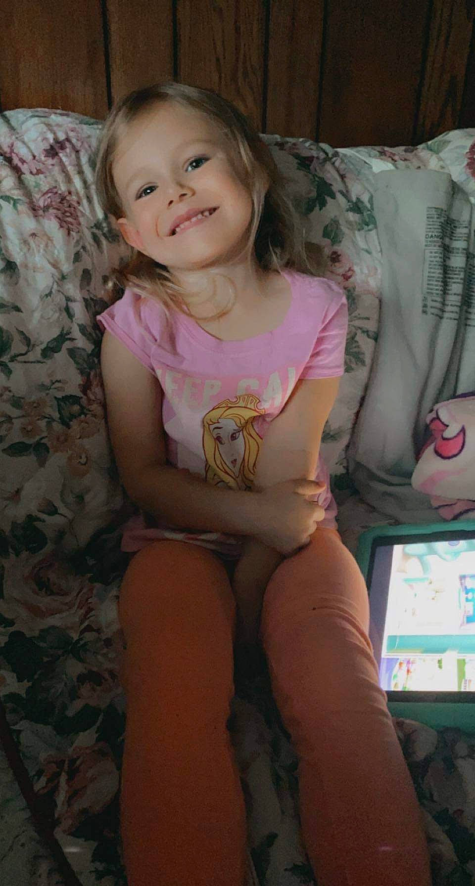 Emily Rose Harman is registered to the contest to win money with this photo: child, face, facial_expression, finger, fun, hairstyle, happy, iris, joint, joy, knee, lap, leg, people, person, pink, shoulder, skin, smile, thigh