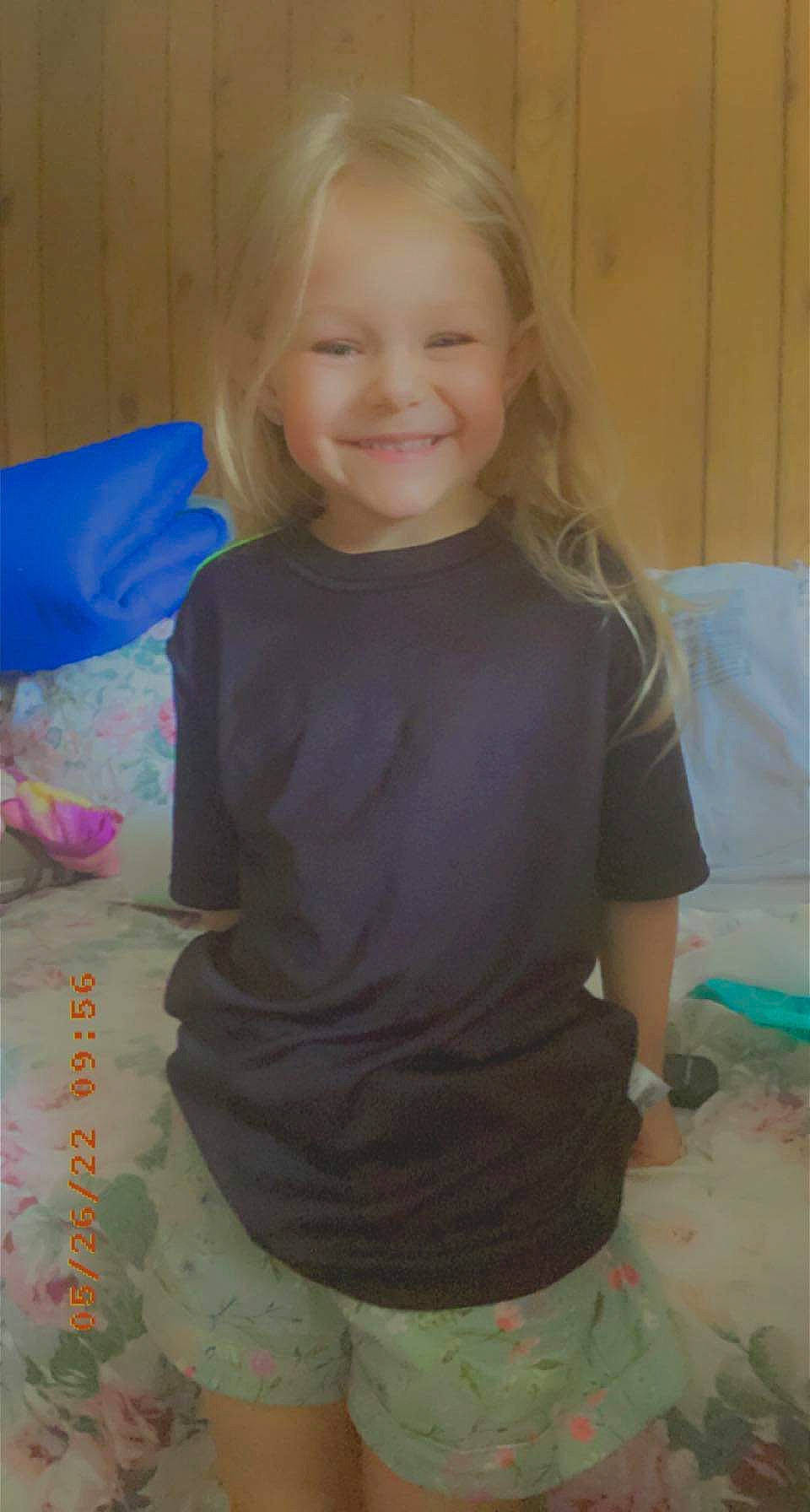 Emily Rose Harman is registered to the contest to win money with this photo: arm, baby_toddler_clothing, cheek, child, elbow, electric_blue, fun, happy, human_body, iris, joy, neck, pattern, person, shoulder, sitting, sleeve, smile, t_shirt, thigh