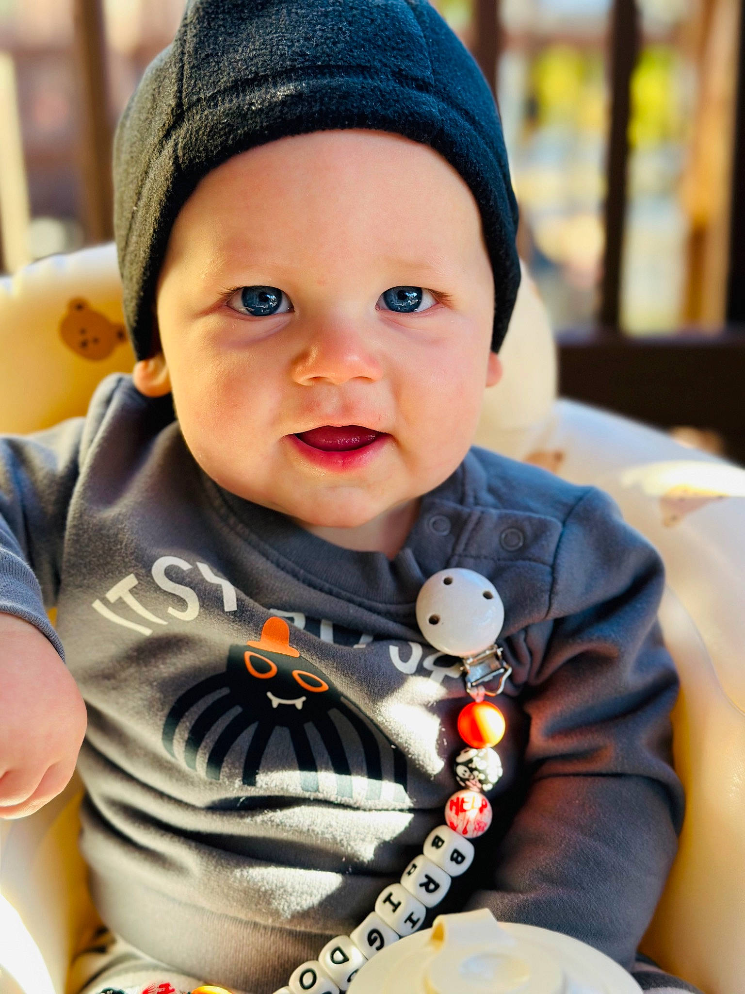 Brigdon joined the competition — help win amazing prizes! baby, baby_carriage, baby_products, baby_toddler_clothing, cap, cheek, child, event, facial_expression, fun, grass, happy, headwear, outerwear, person, sitting, skin, sleeve, smile, t_shirt