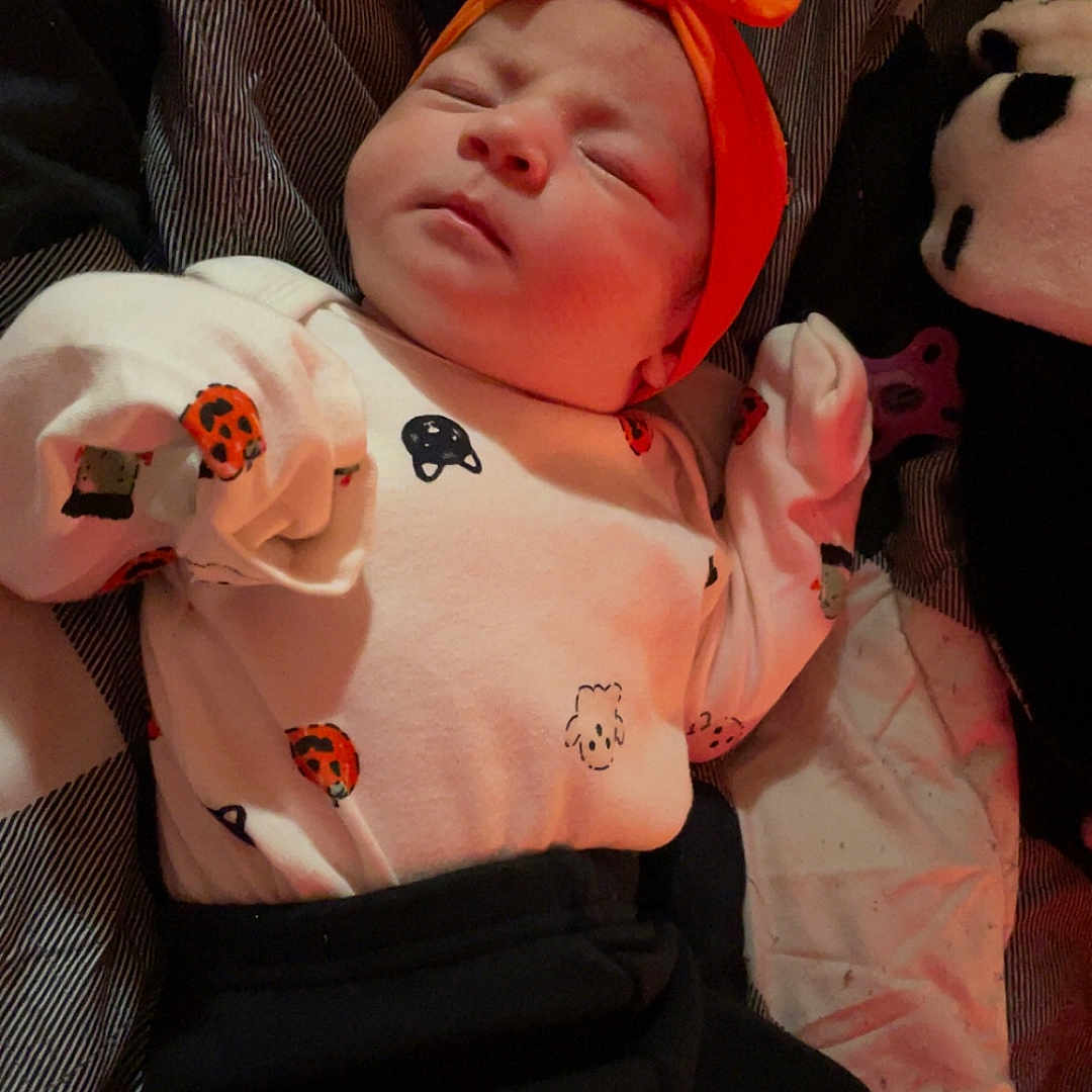 Kinsley joined the competition — help win amazing prizes! animal, baby, bodypart, bonnet, cap, clothing, couch, face, finger, furniture, hand, hat, head, insect, invertebrate, newborn, person, photography, portrait, sleeping