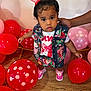 toddler, child, balloons, red, pink, polka_dot, denim_vest, skirt, shoes, bow, hair, floor, hand, wooden_floor, indoor, person, clothing, cute, standing, support