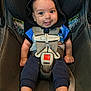 baby, infant, car_seat, child, smile, hoodie, seatbelt, safety, cute, blue_clothing, happy, person, foot, hand, straps, seat, indoors, portrait, young_child, looking_at_camera