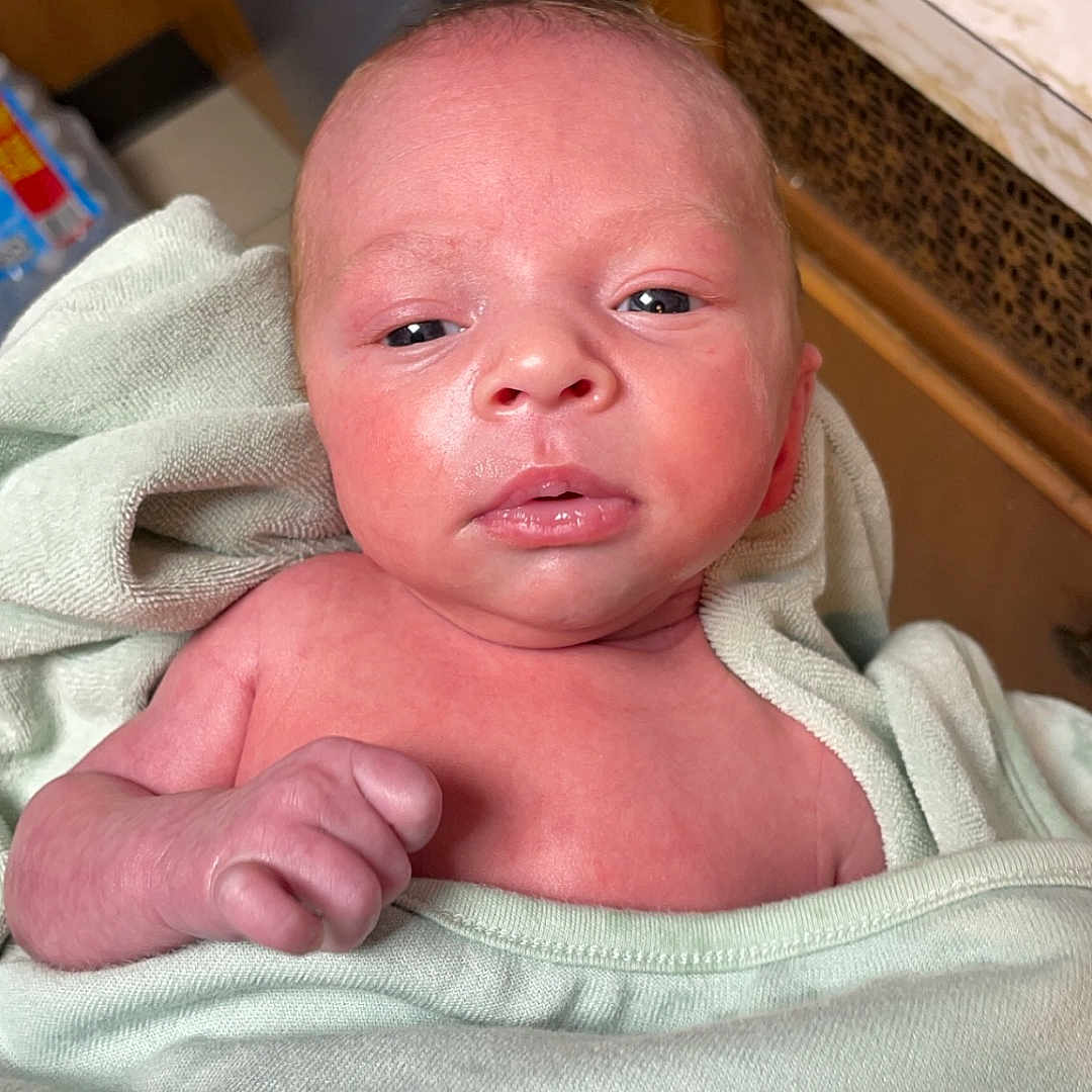 Alixander is registered to the contest to win money with this photo: architecture, baby, blanket, bodypart, building, cabinet, clothing, face, finger, furniture, glove, hand, head, newborn, person, photography, portrait, shelf, sleeping, towel