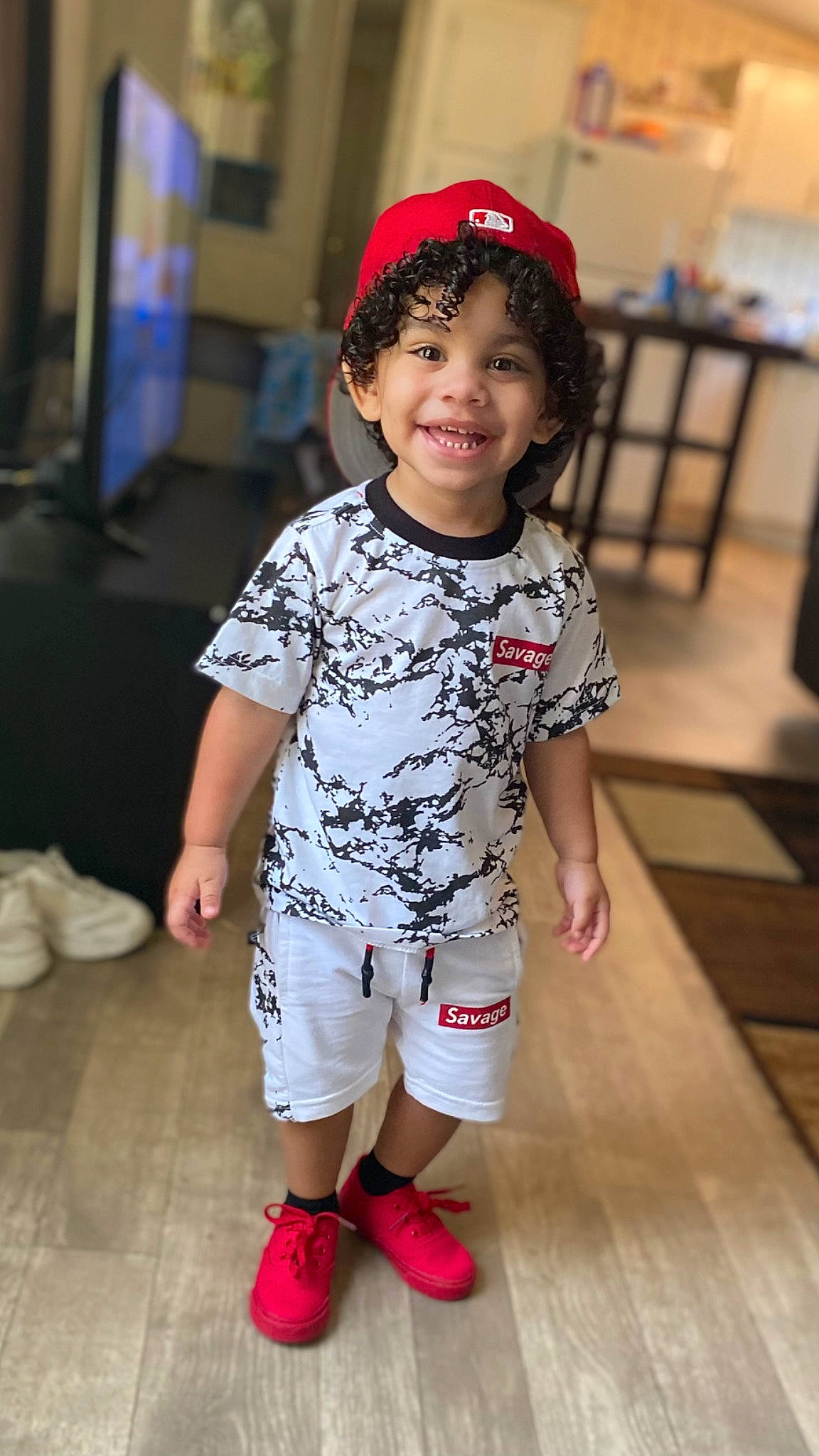 Bryson joined the competition — help win amazing prizes! baby_toddler_clothing, child, event, fashion_design, floor, flooring, fun, happy, head, human_leg, joy, knee, leg, person, red, shoe, skin, sleeve, smile, sneakers