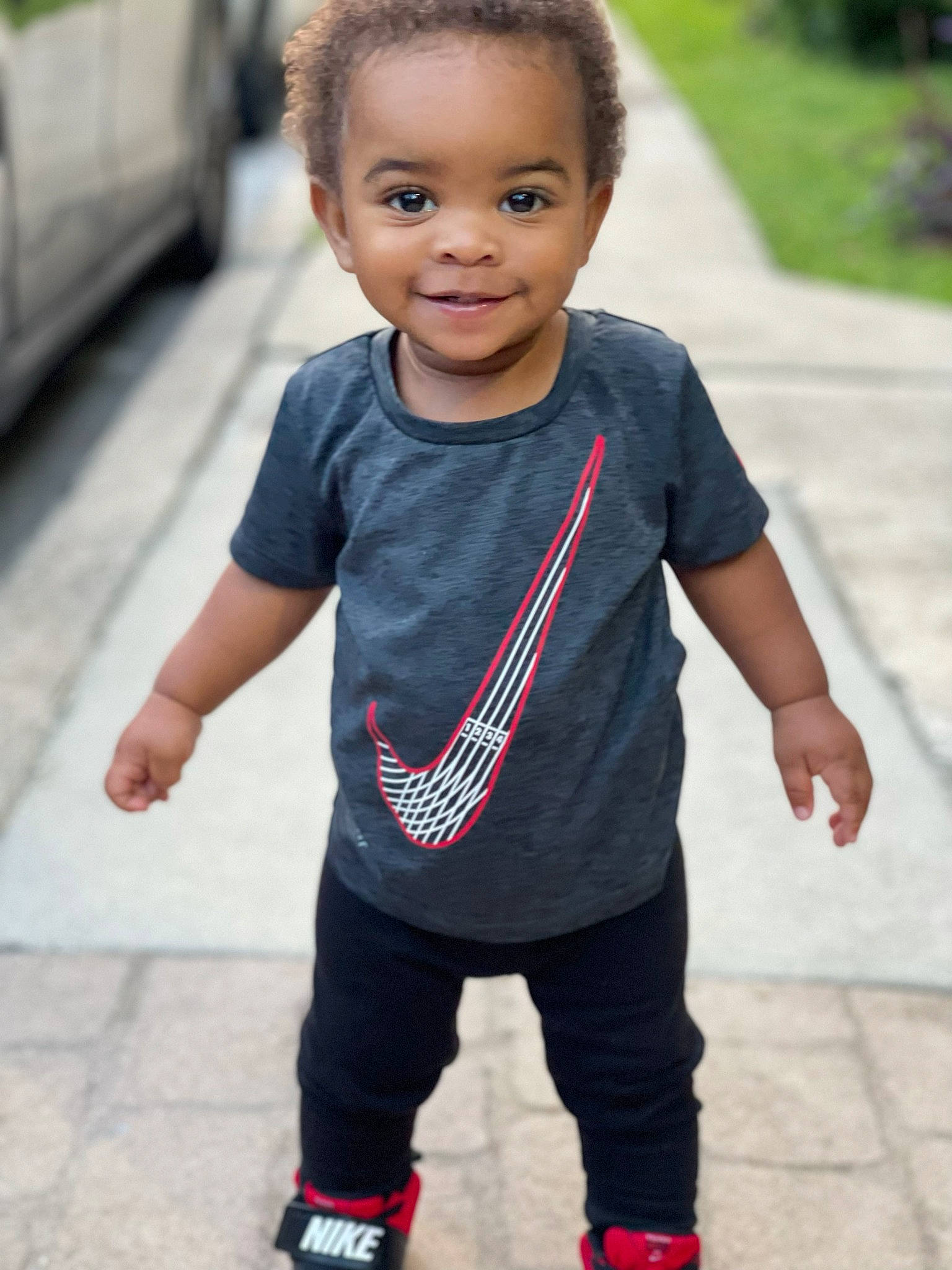 Derrick is registered to the contest to win money with this photo: asphalt, baby_toddler_clothing, eye, face, fun, gesture, hair, hairstyle, happy, head, joy, leisure, neck, person, shoulder, sleeve, smile, sportswear, street_fashion, style
