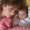 baby, child, couch, curly_hair, face, family, furniture, infant, indoors, pink_blanket, portrait, sibling, smile, soft_texture, toddler, twin, two_people, young_child, blanket, cozy