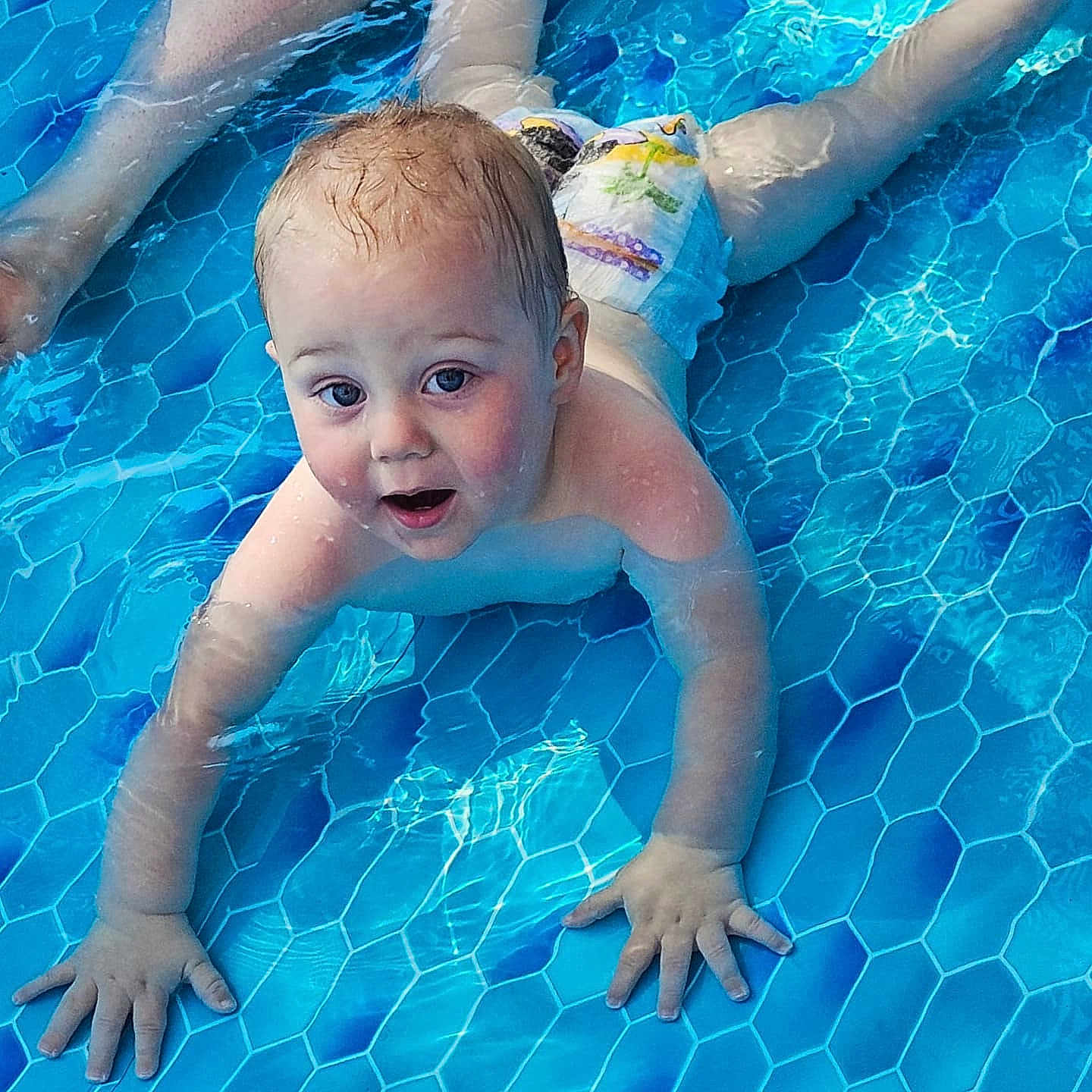 Ronan is registered to the contest to win money with this photo: baby, blue, child, cute, diaper, expression, fun, hands, infant, legs, outdoor, person, play, pool, safety, skin, splash, summer, swimming, water