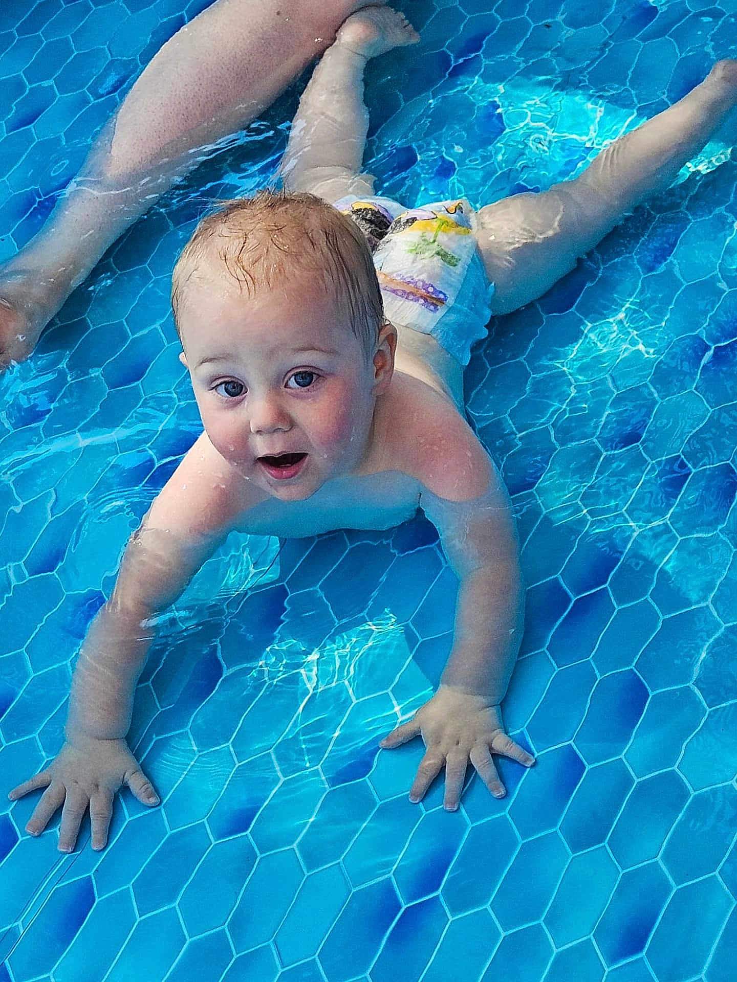 Ronan is registered to the contest to win money with this photo: baby, child, pool, water, diaper, blue, skin, hands, legs, swimming, infant, cute, splash, summer, fun, outdoor, play, safety, person, expression