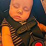 accessories, baby, belt, car, car_interior, carseat, clothing, cushion, dynamite, electronics, face, head, homedecor, lifejacket, person, photography, portrait, sleeping, vest, weapon