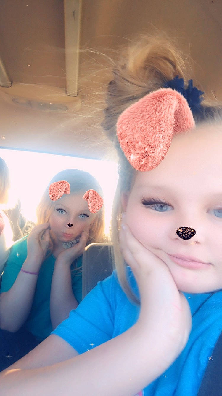 Kenzli is registered to the contest to win money with this photo: baby, blue, cheek, child, ear, eye, face, fur, head, headgear, iris, lip, nose, person, pink, skin, smile, stuffed_toy, teddy_bear, toddler