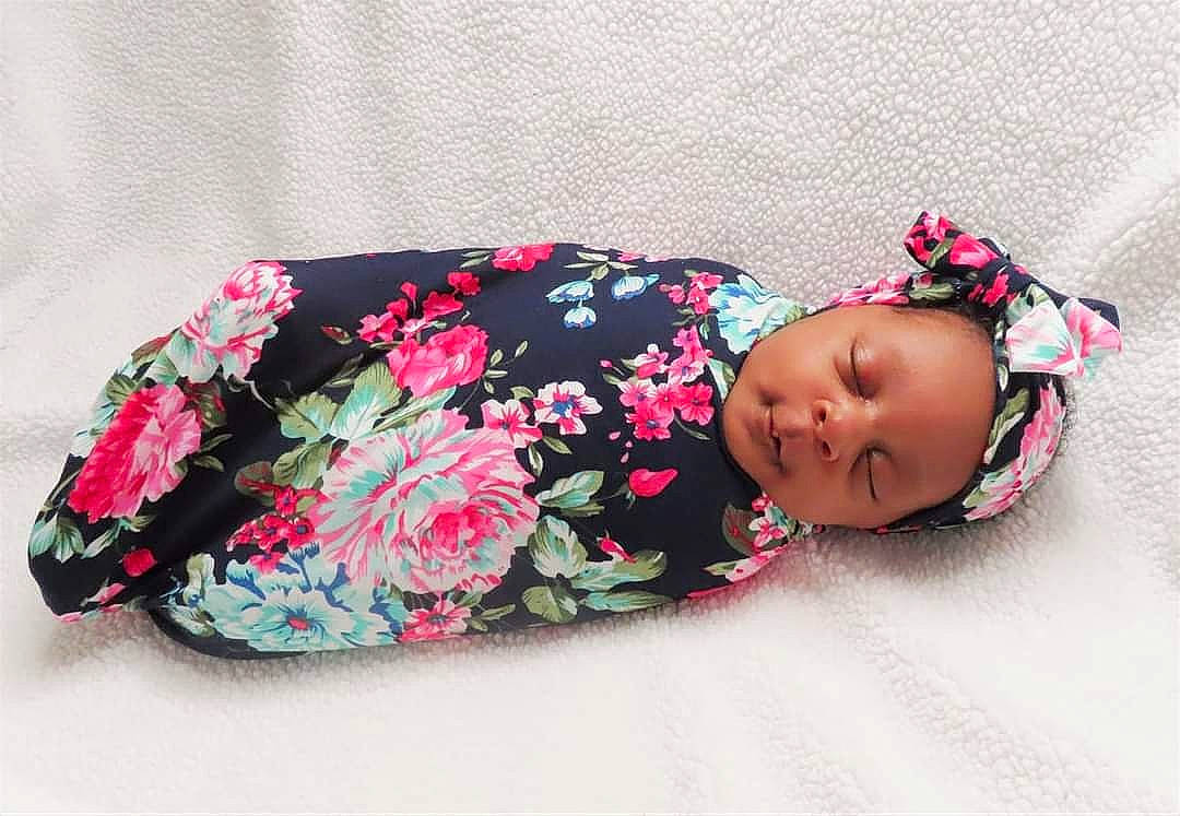 Olive joined the competition — help win amazing prizes! baby, baby_products, baby_toddler_clothing, child, comfort, fashion_accessory, hair_accessory, headgear, human_body, linens, magenta, mammal, outerwear, pattern, person, pink, product, skin, sleeve, textile