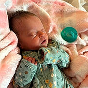 Ahlianice is registered to the contest to win money with this photo: baby, blanket, child, cozy, cute, face, floral, indoors, infant, newborn, onesie, pacifier, peaceful, pink, portrait, resting, sleeping, small, soft, toddler