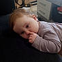 Cassidy participe au concours pour gagner de l'argent avec cette photo : baby, child, clothing, curious, drawer, face, floor, furniture, hair, hand, head, indoor, log, nose, person, resting, sleeve, table, tile, wood