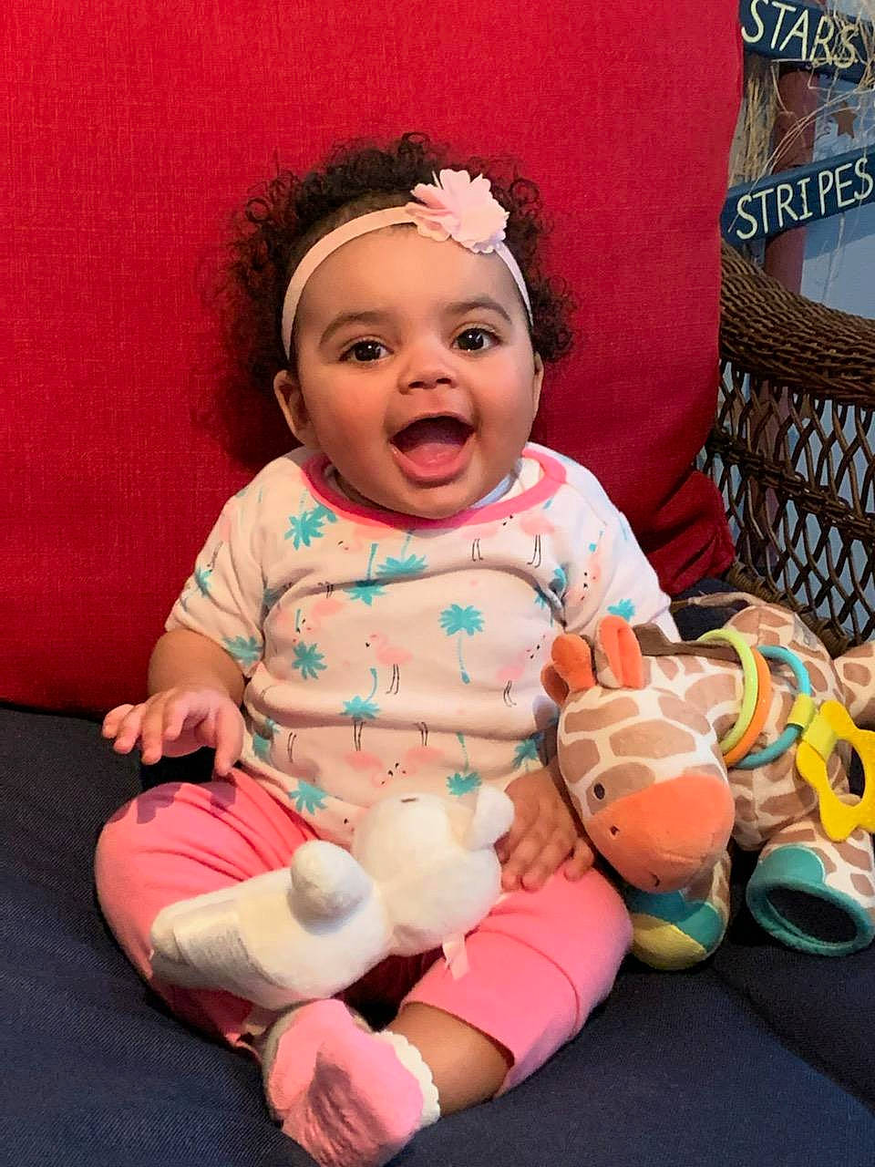 Tatiana is registered to the contest to win money with this photo: abdomen, baby, baby_products, baby_toddler_clothing, barefoot, cheek, child, dress, foot, fun, happy, headwear, human_leg, leisure, mouth, person, pink, sitting, skin, smile