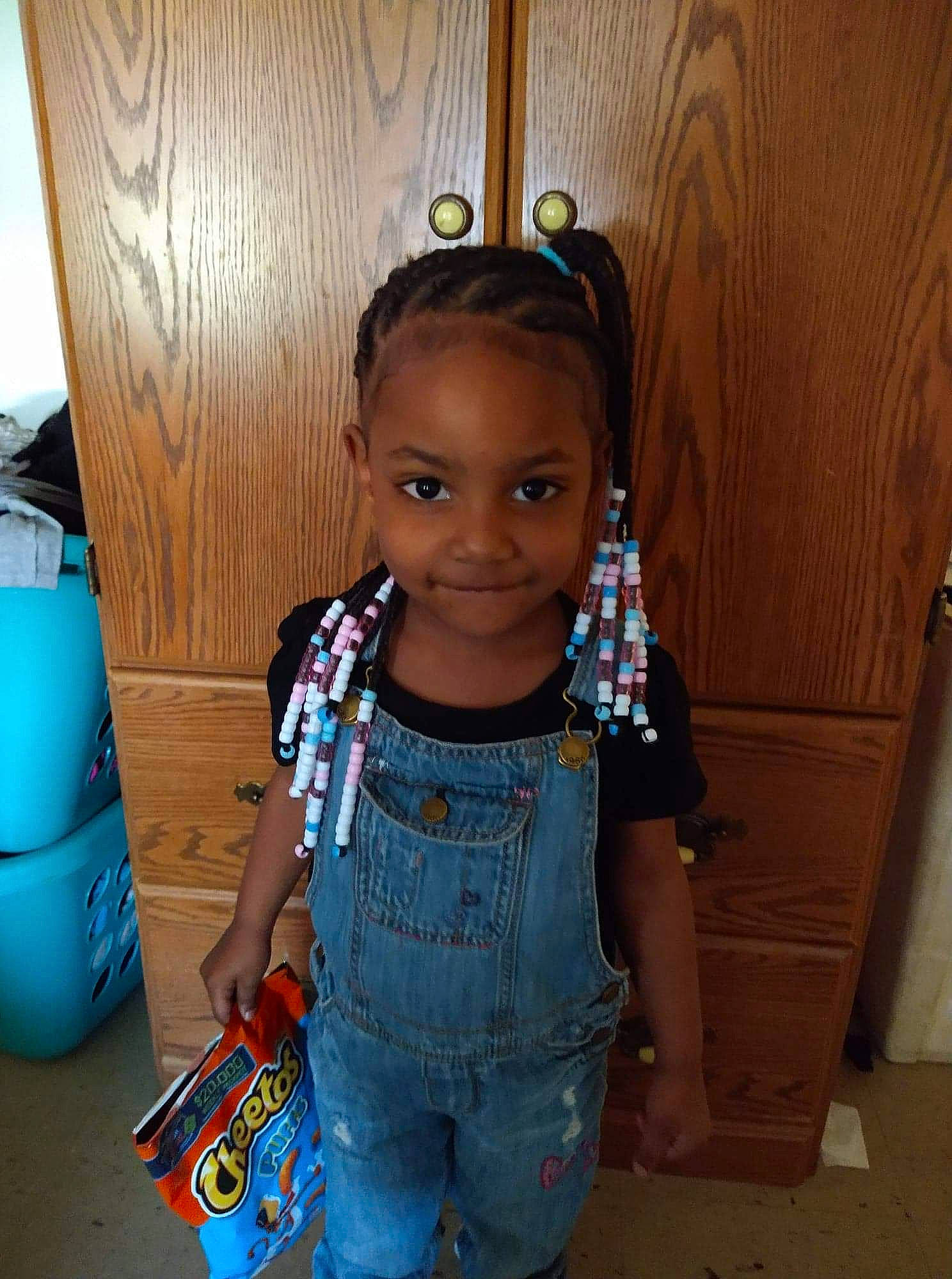 Jessia is registered to the contest to win money with this photo: baby_toddler_clothing, black_hair, blue, child, denim, electric_blue, eye, flooring, fun, happy, home_appliance, iris, jewellery, joy, person, room, sitting, skin, sleeve, t_shirt