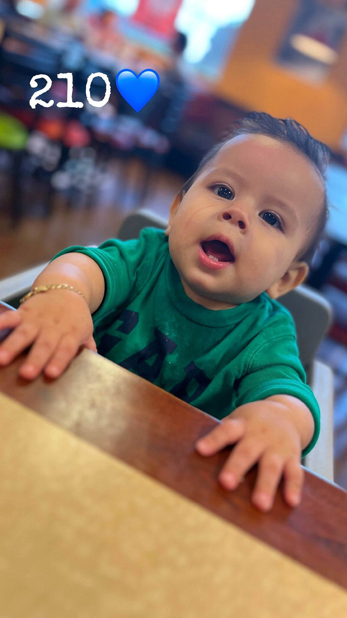 Jorge is registered to the contest to win money with this photo: baby, baby_toddler_clothing, chair, cheek, child, flash_photography, flooring, fun, happy, hardwood, human, leisure, person, recreation, sitting, skin, table, toddler, varnish, wood